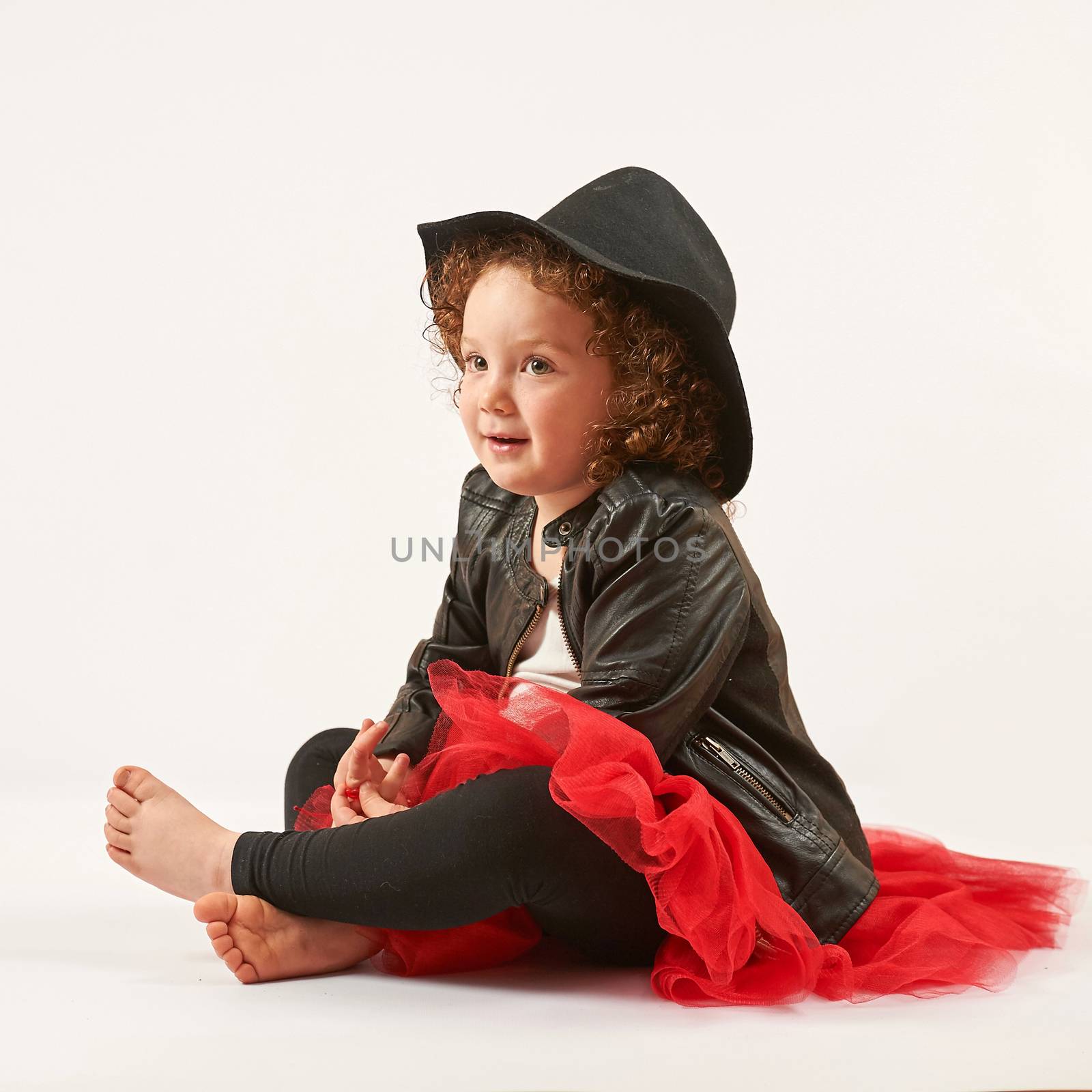 Little Girl Fashion Model With Black Hat by Multipedia