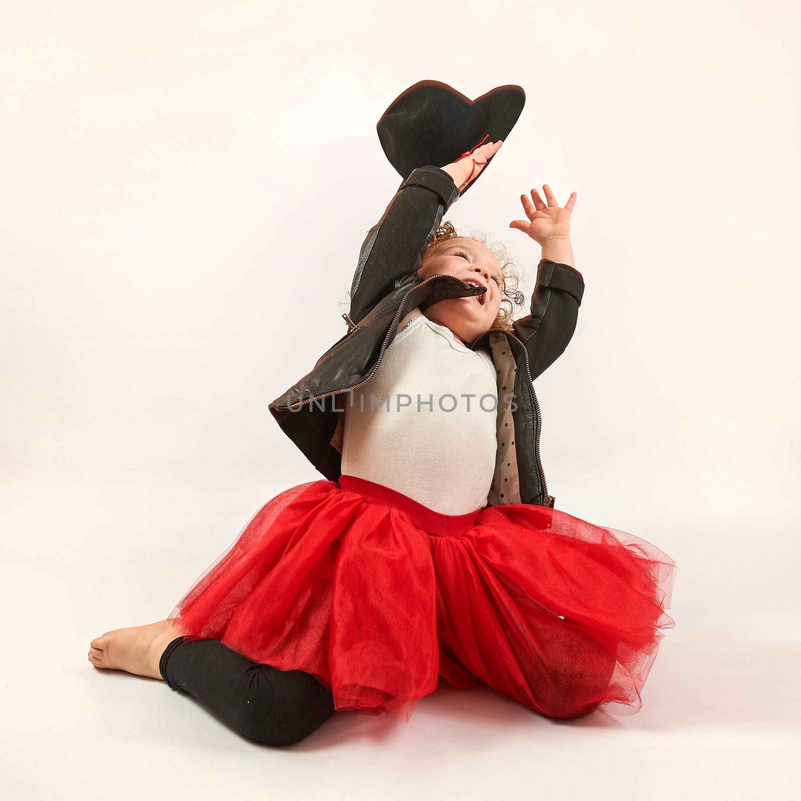 Little Girl Fashion Model With Black Hat by Multipedia