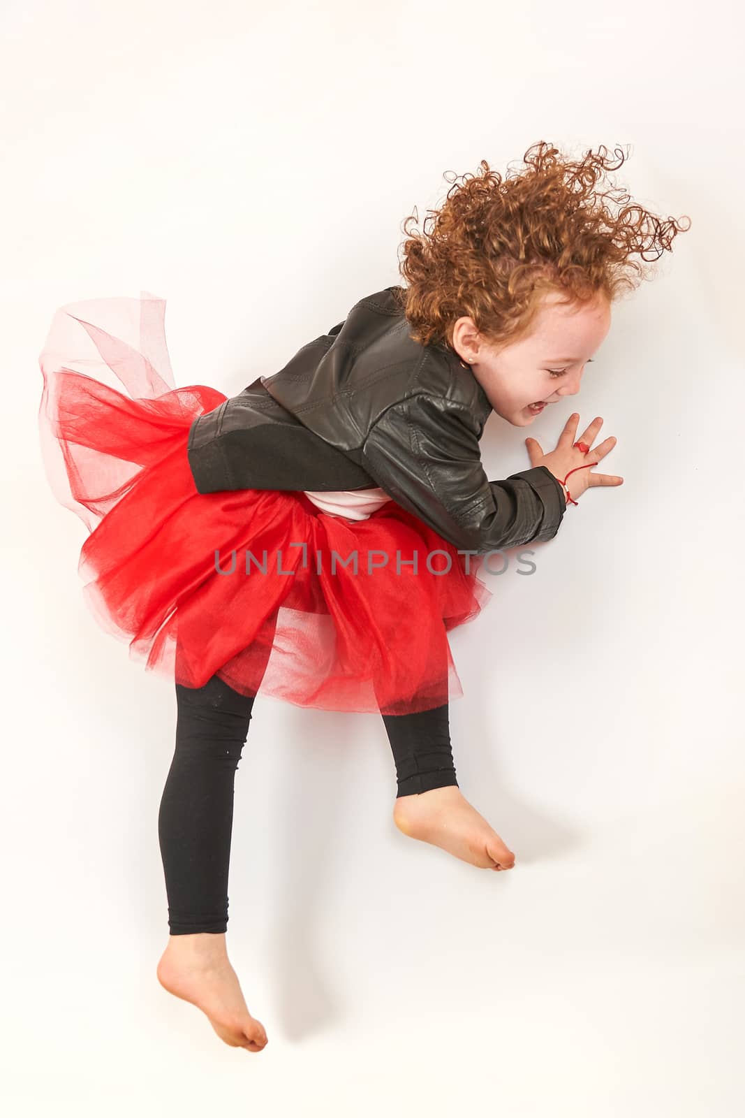 Little Girl Fashion Model With Black Hat by Multipedia