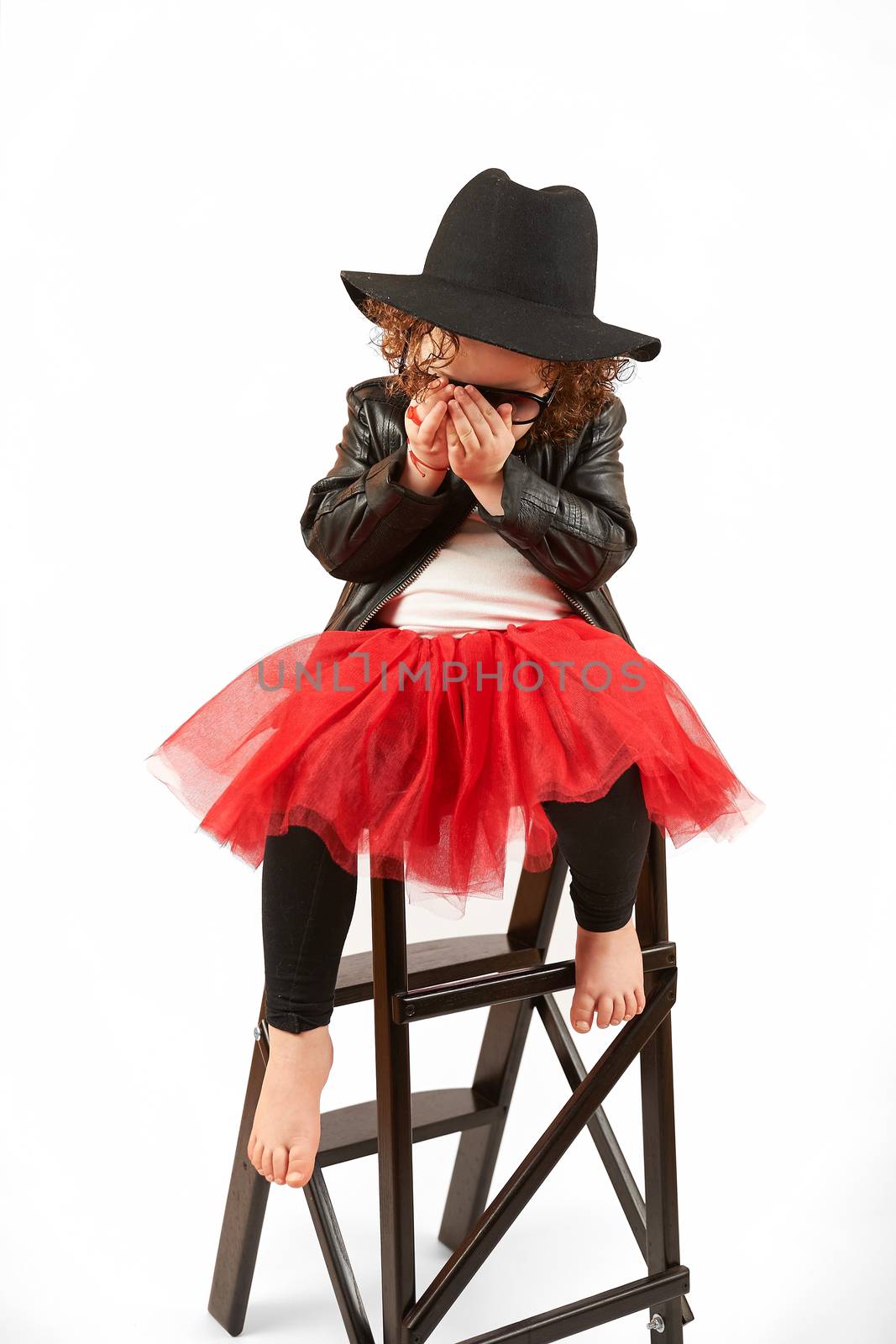 Little Girl Fashion Model With Black Hat by Multipedia