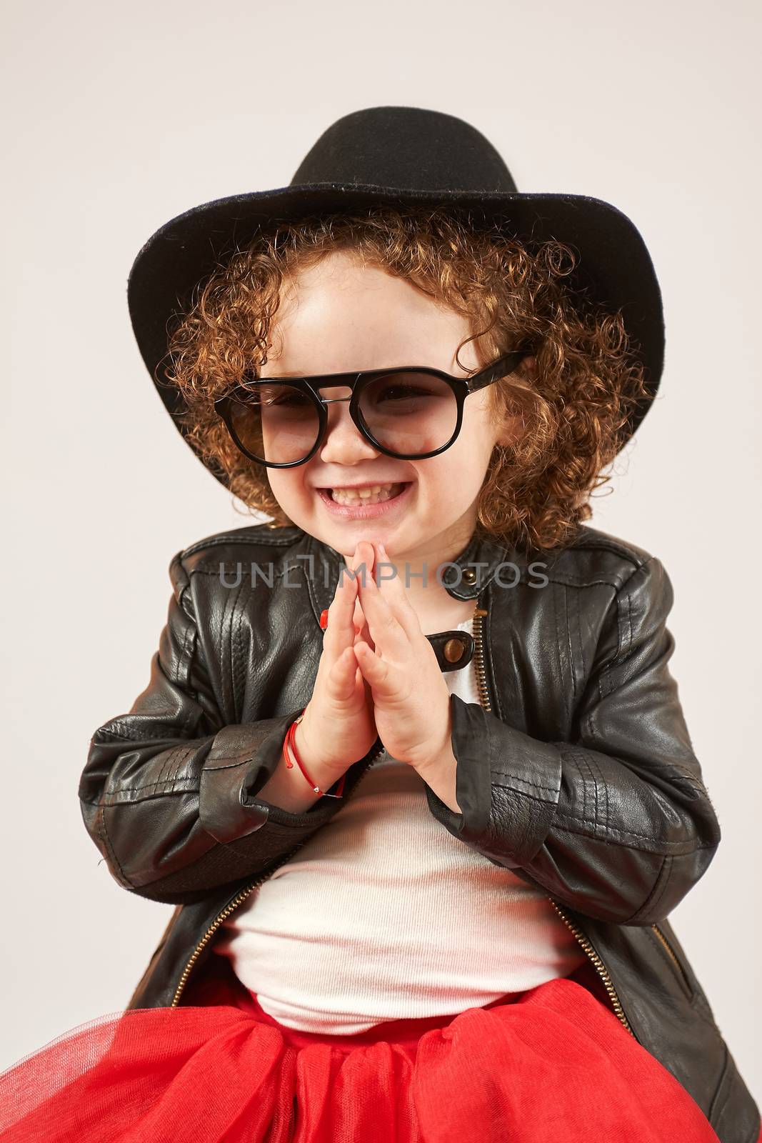 Little Girl Fashion Model With Black Hat by Multipedia