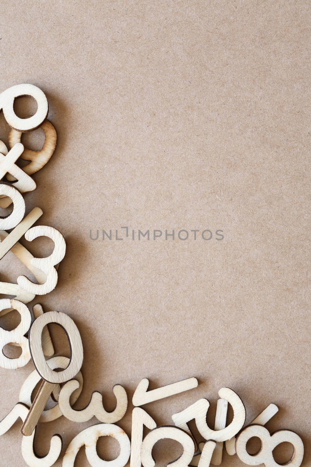 Bookkeeping symbol. Set of wooden digits as border on brown paper background