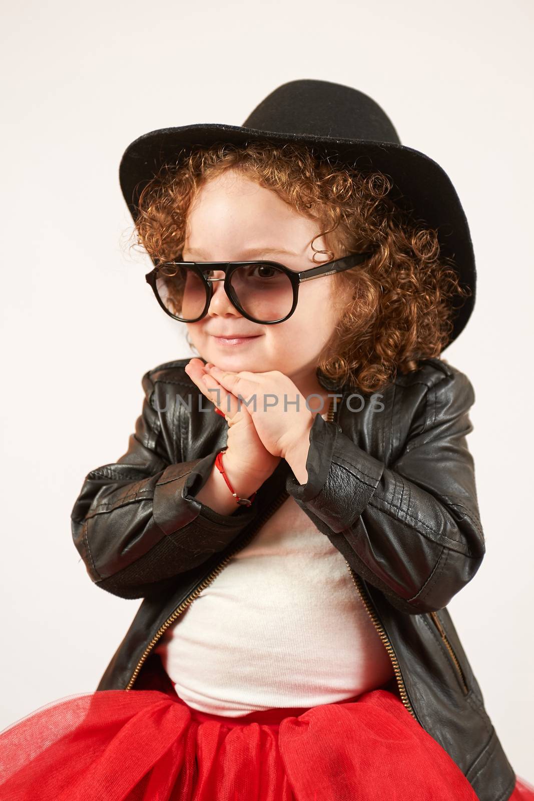 Little Girl Fashion Model With Black Hat by Multipedia