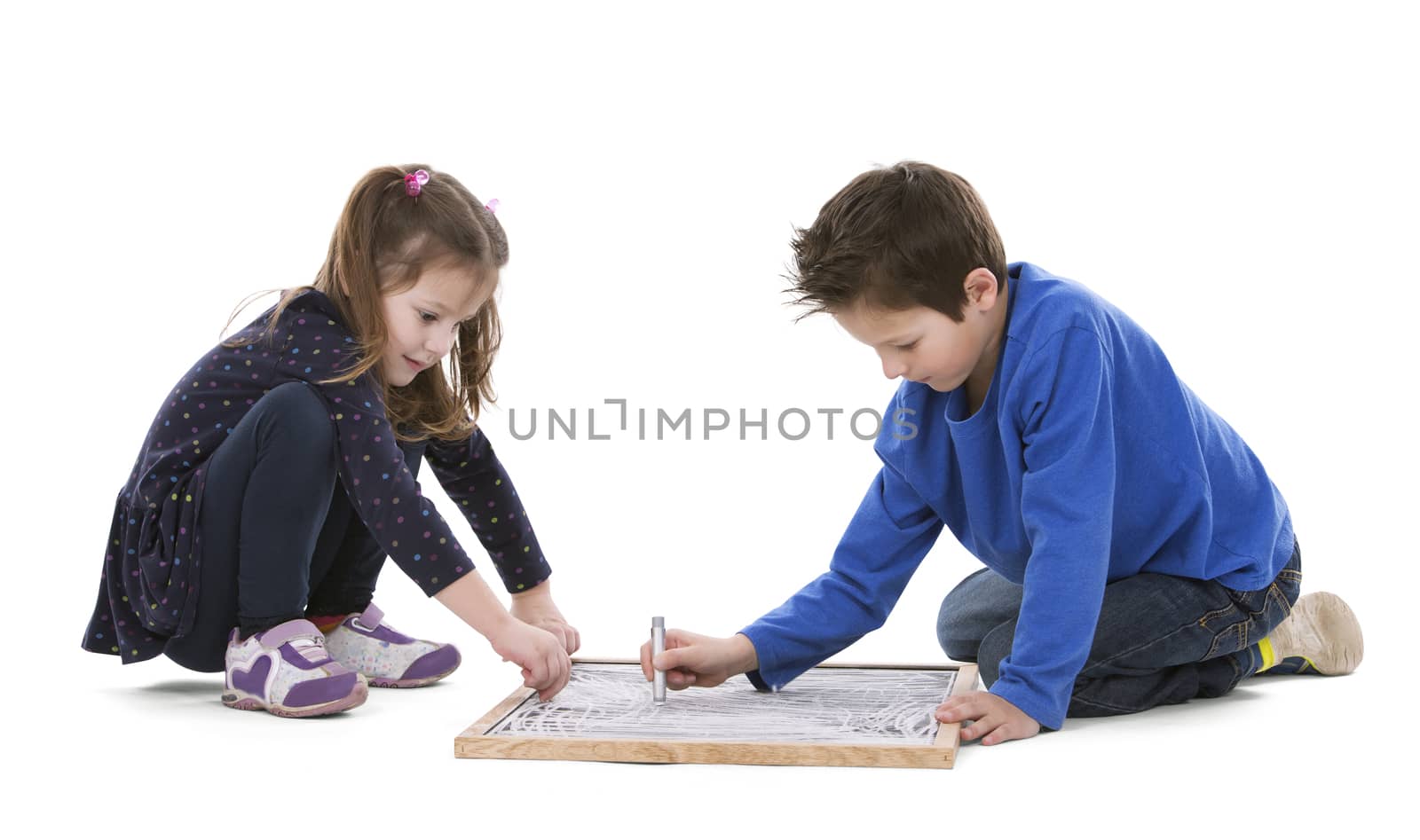 girl and boy playing with chalk board on white isolated background