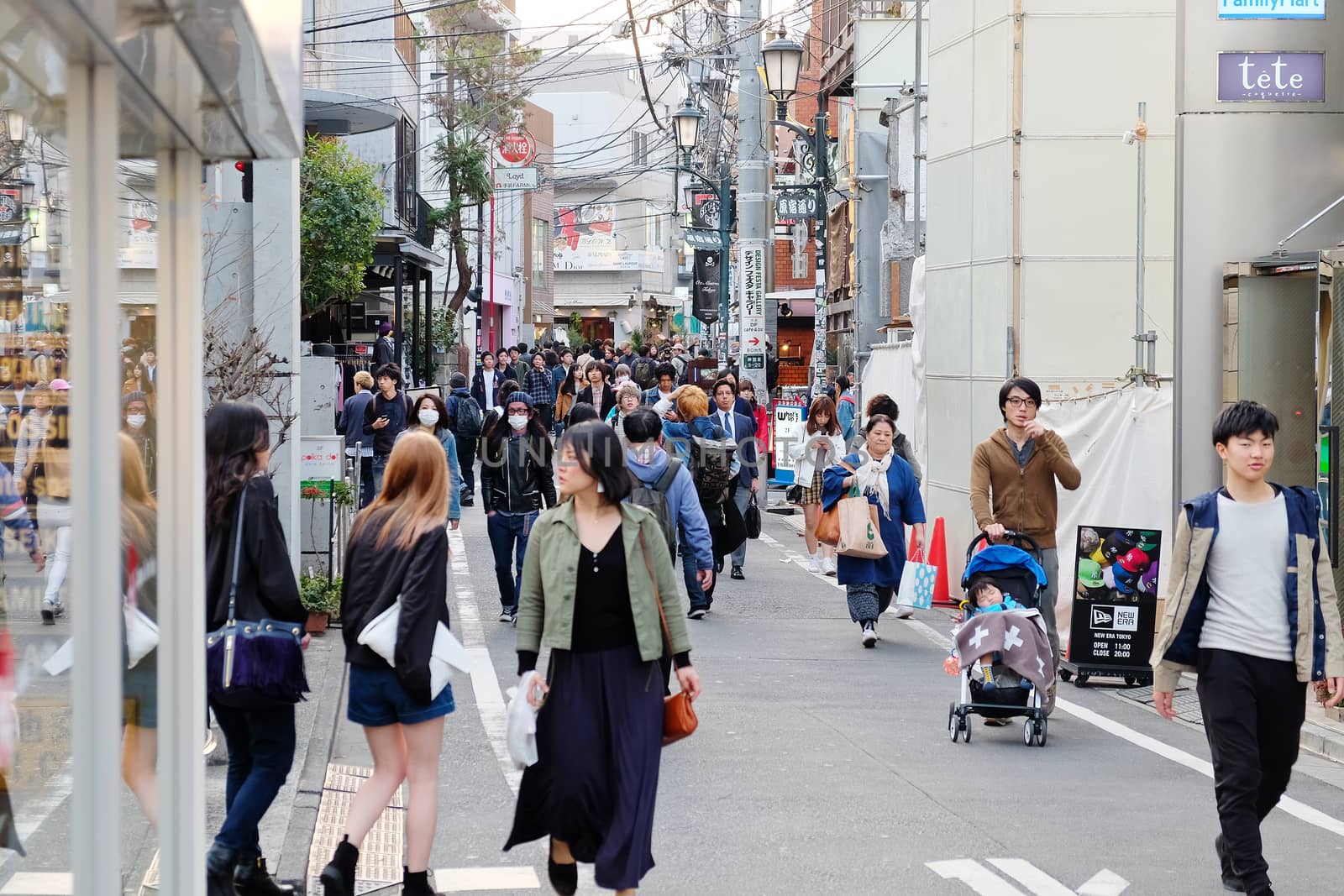 Tokyo, Japan - March 30, 2016 : Tourists and business people in Ura-Harajuku street,Harajuku is known as a center of Japanese youth culture and fashion.