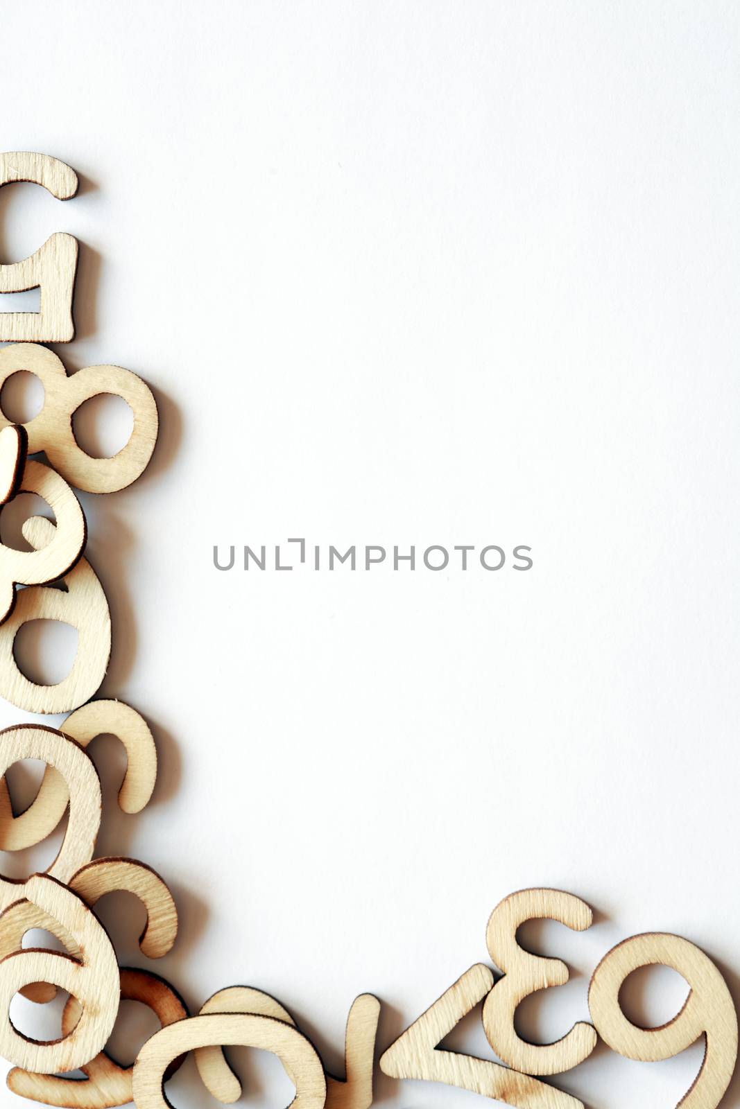 Bookkeeping symbol. Set of wooden digits as border on white paper background