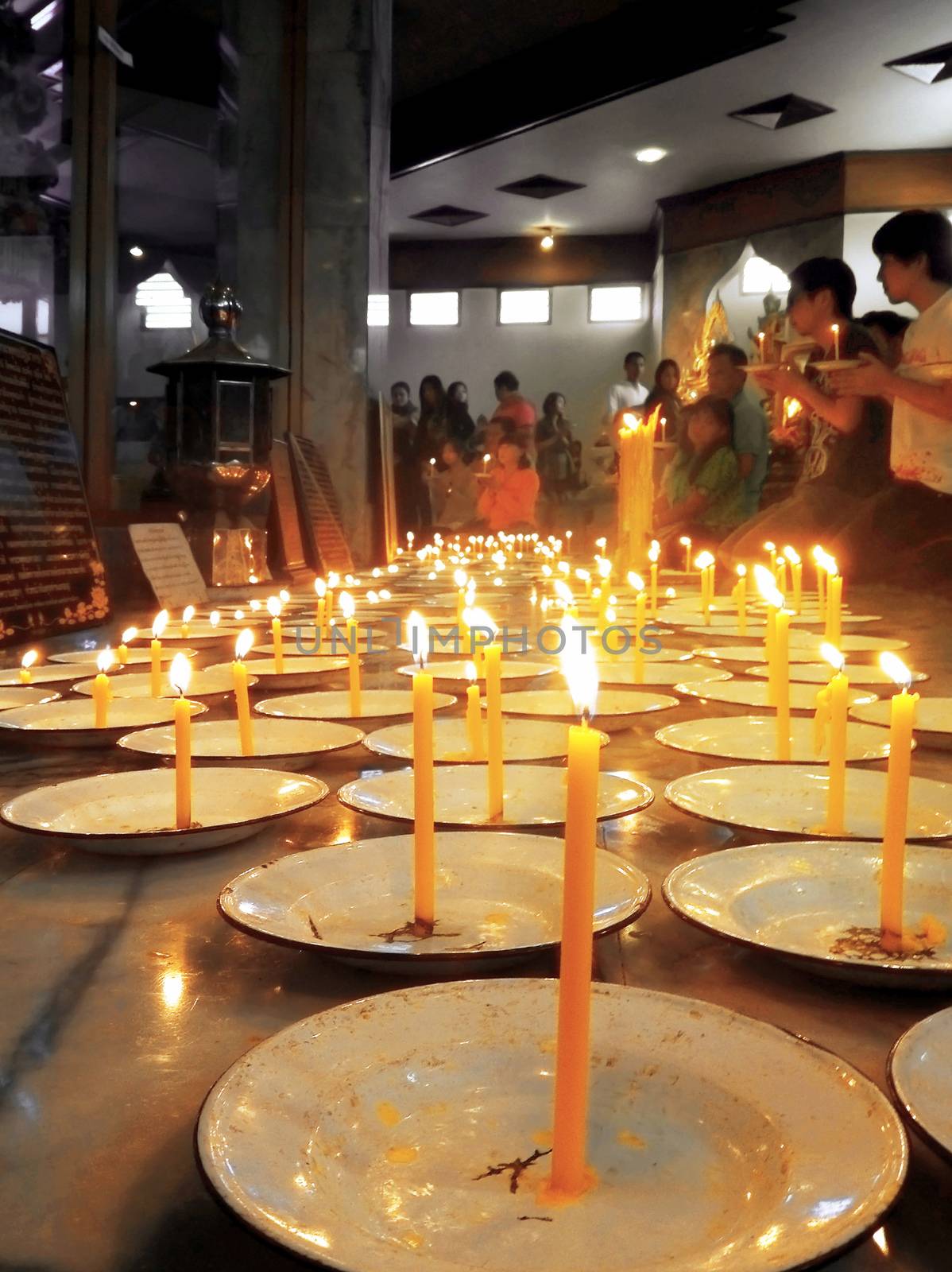 Khao Kho District, Phetchabun, THAILAND - DECEMBER 10, 2012 : Buddhists l lighting candles to worship the Buddha at Kanchanapisek Pagoda,Khao Kho District, Phetchabun, THAILAND