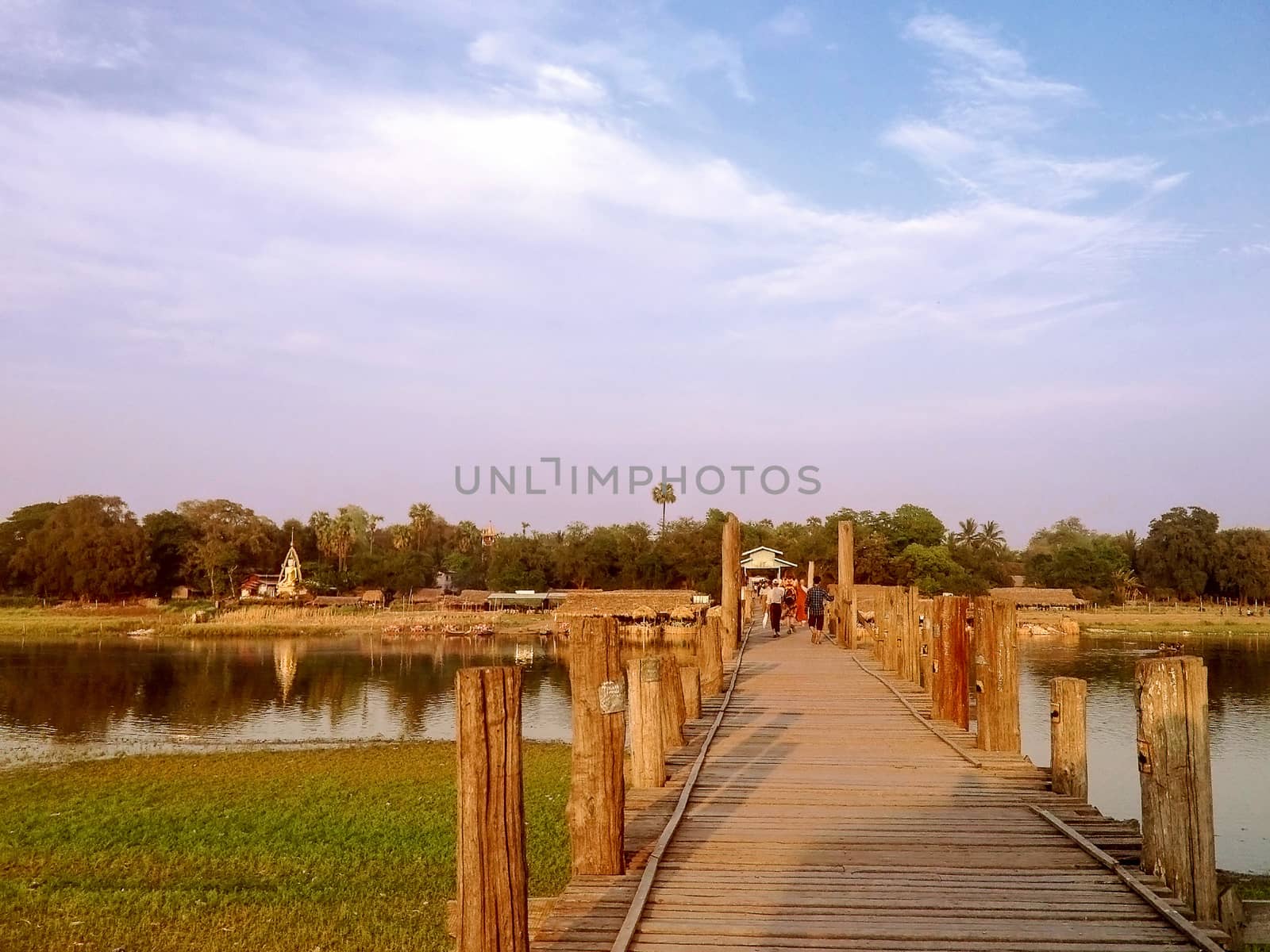 Mandalay, U Bein Bridge, Myanmar - APRIL 21 : The Burmese people walking on the U Bein bridge, Taung Tha Man Lake in Amarapura, Mandalay, Myanmar APRIL 21 2013.