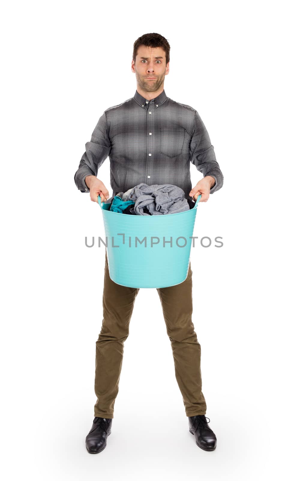 Full length portrait of a young man holding a laundry basket by michaklootwijk