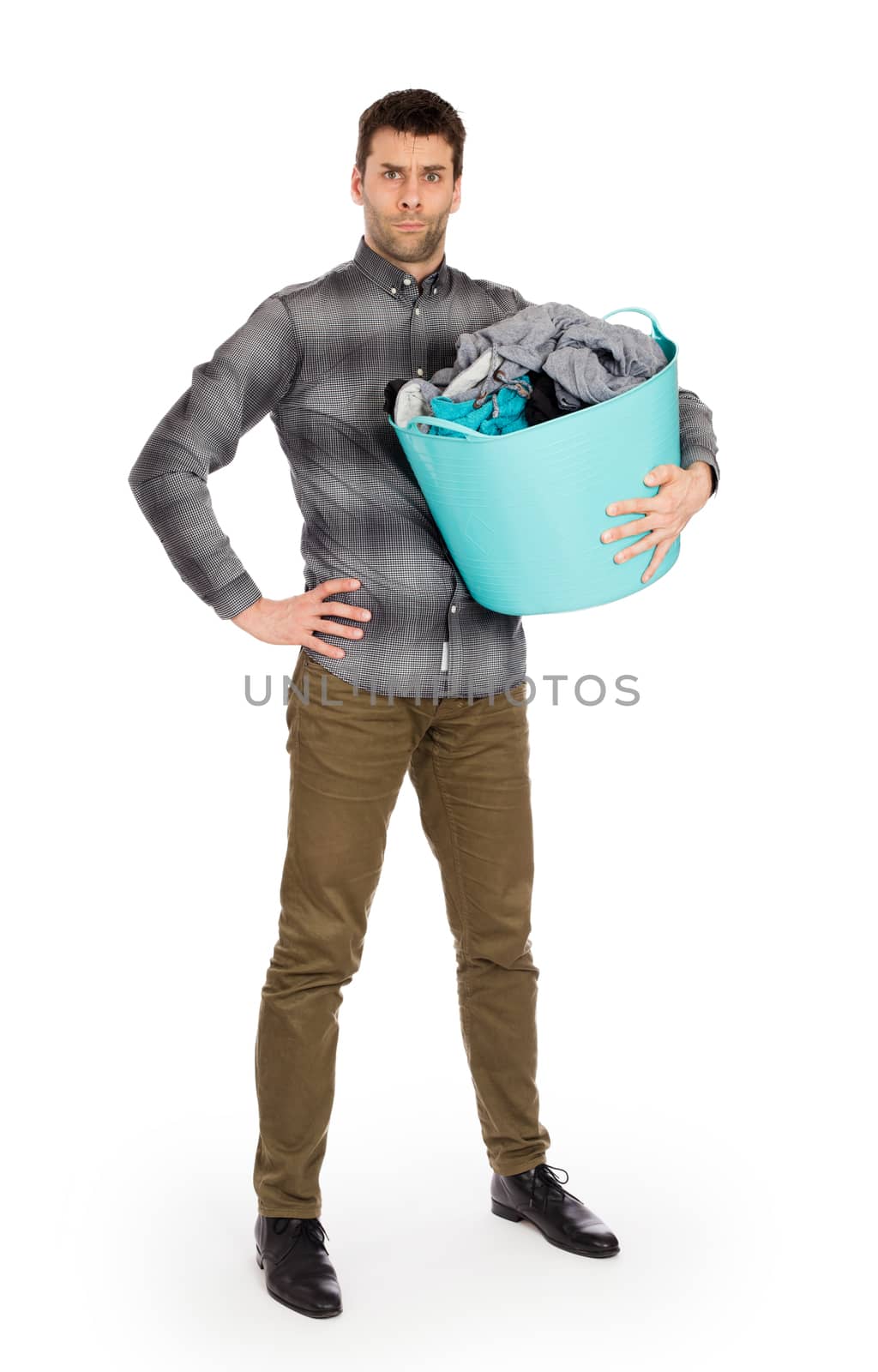 Full length portrait of a young man holding a laundry basket isolated on white background