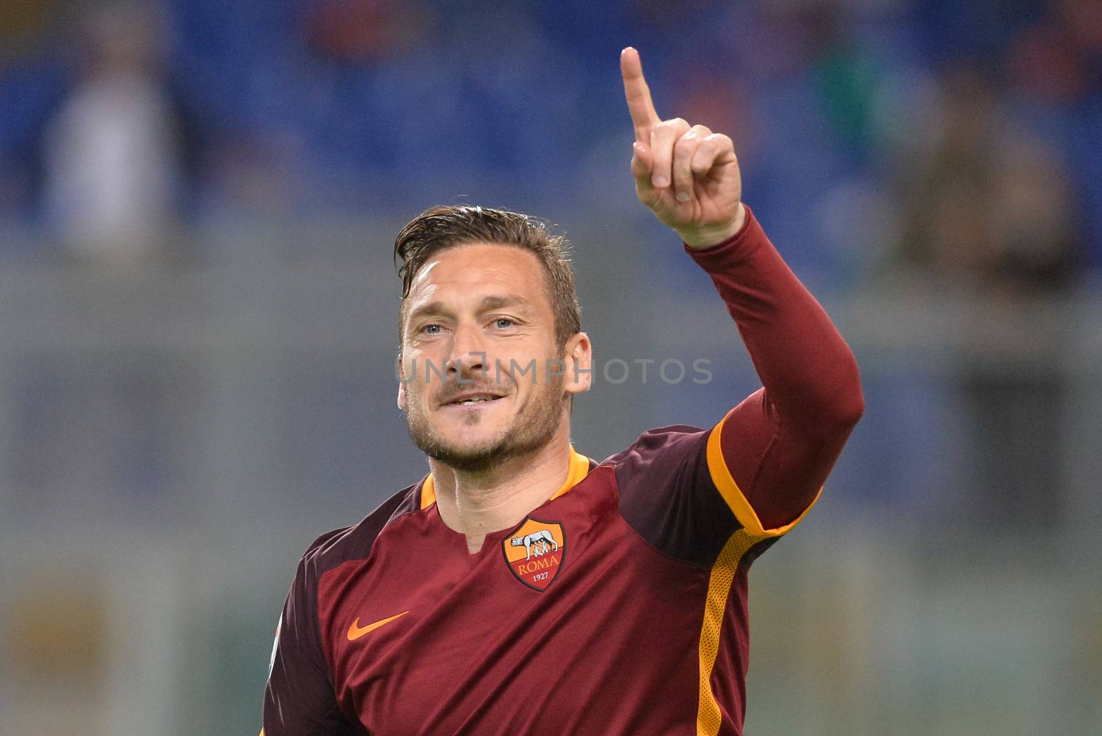 ITALY, Rome: Francesco Totti of AS Roma celebrates after scoring the team's third goal from penalty spot during the Serie A match between AS Roma and Torino FC at Stadio Olimpico on April 20, 2016 in Rome, Italy. 
