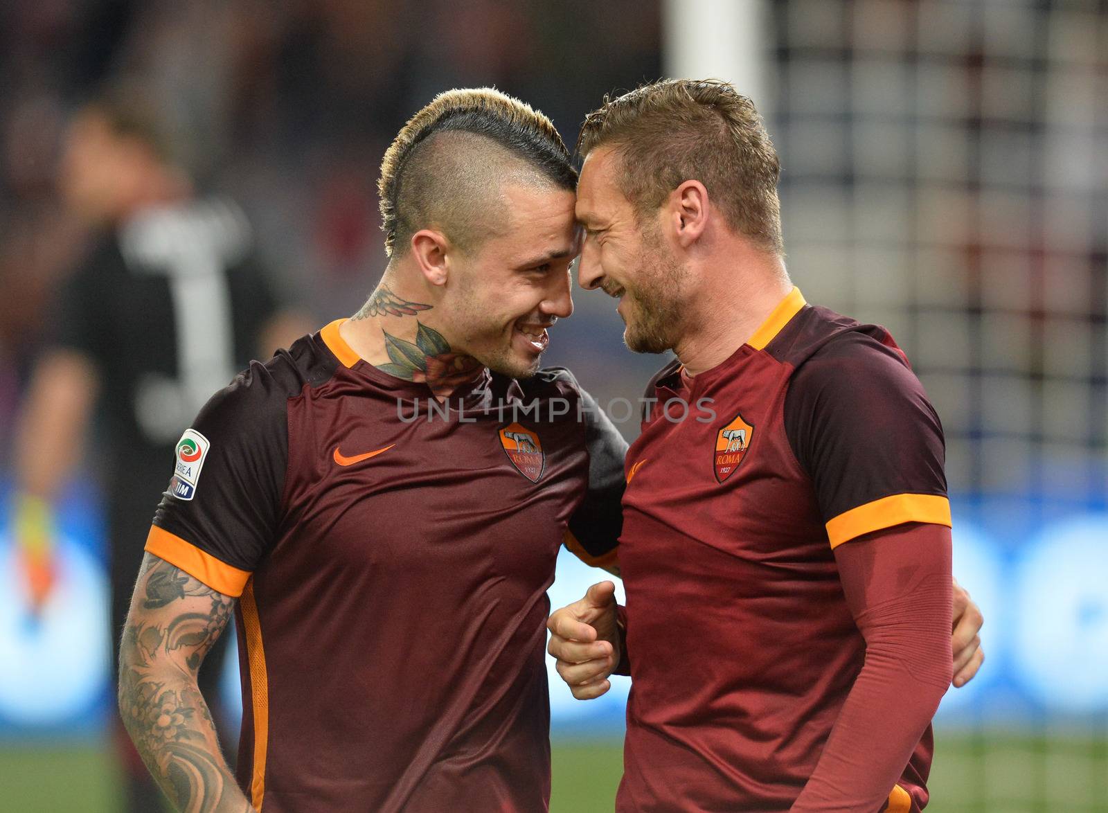ITALY, Rome: Francesco Totti and Radja Nianggolan of AS Roma celebrate after scoring the team's third goal from penalty spot during the Serie A match between AS Roma and Torino FC at Stadio Olimpico on April 20, 2016 in Rome, Italy. 