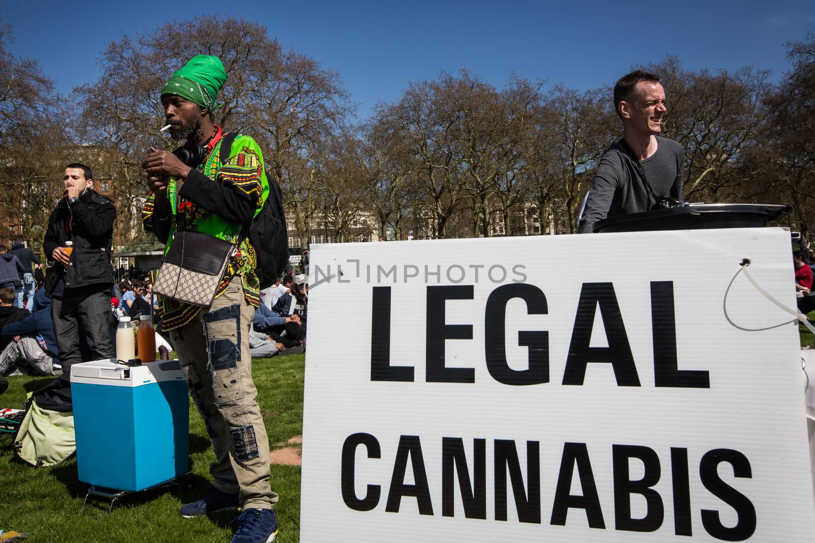 UNITED-KINGDOM, London: A picture is taken of a banner reading Legal cannabis as hundreds of pro-cannabis supporters gather in Hyde Park, in London for 4/20 day, a giant annual smoke-in  on April 20, 2016. 