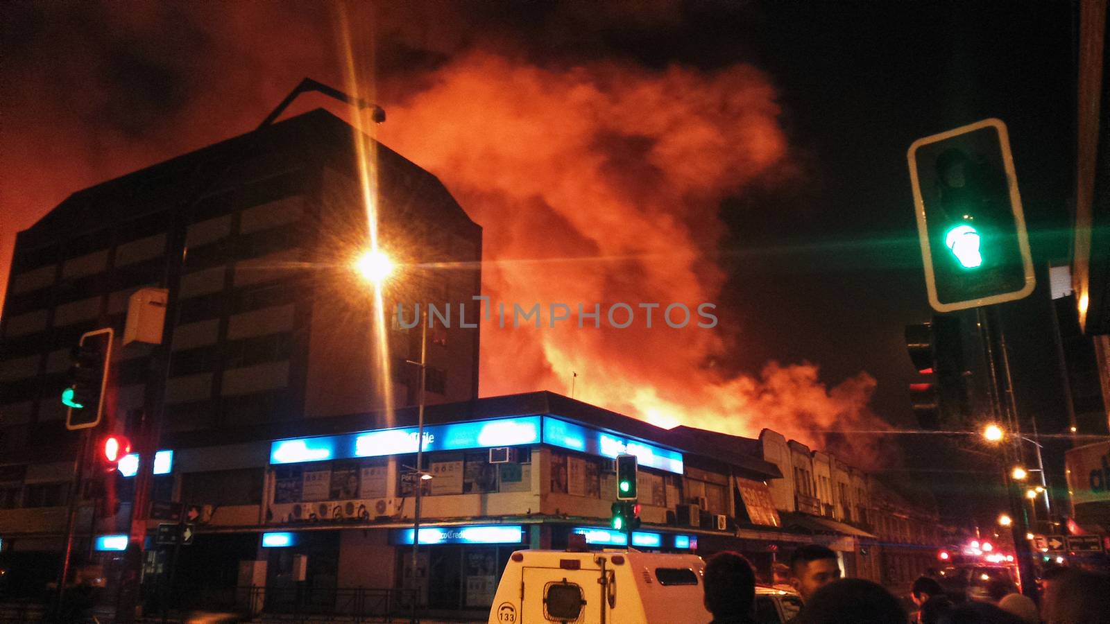 CHILE, Temuco: A massive fire hits the municipal market of Temuco, in the Cautin province, southern Chile, on the evening of April 20, 2016. At least two firefighters have been injured as over 400 people worked to evacuate nearby residents.