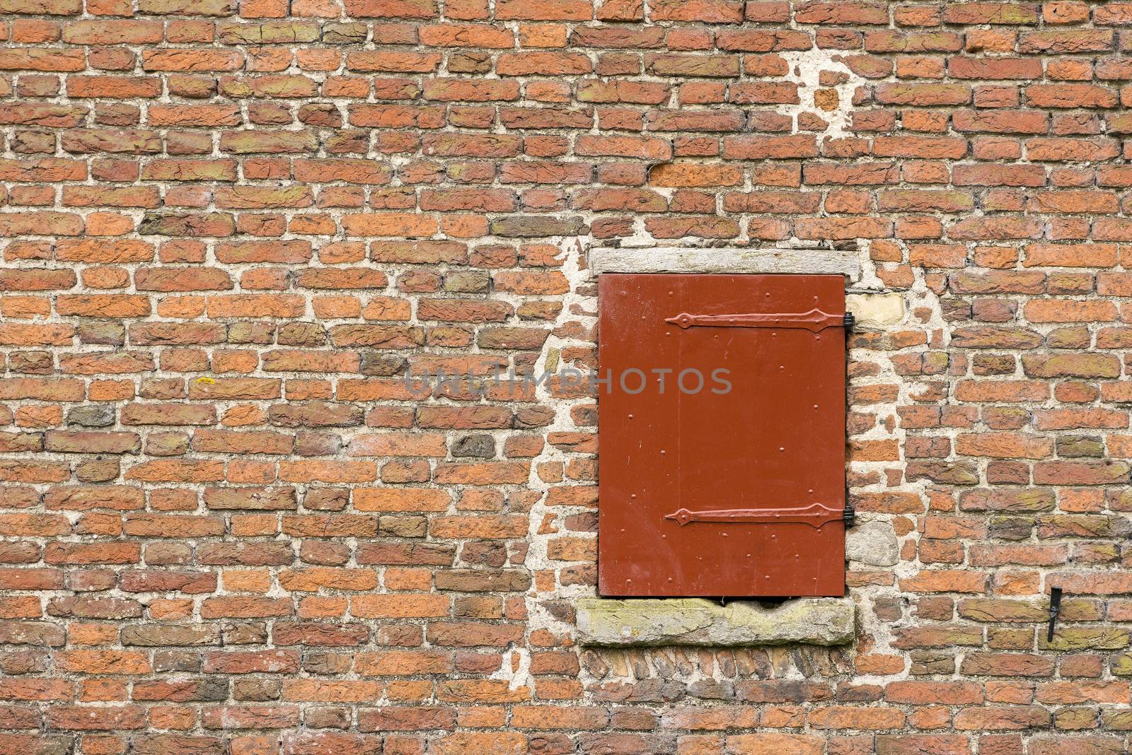 Old fortress wall with a wooden hatch
 by Tofotografie