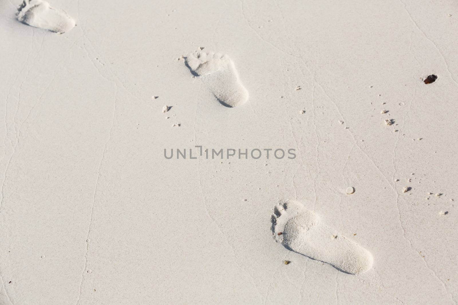 human footprints in the smooth sand