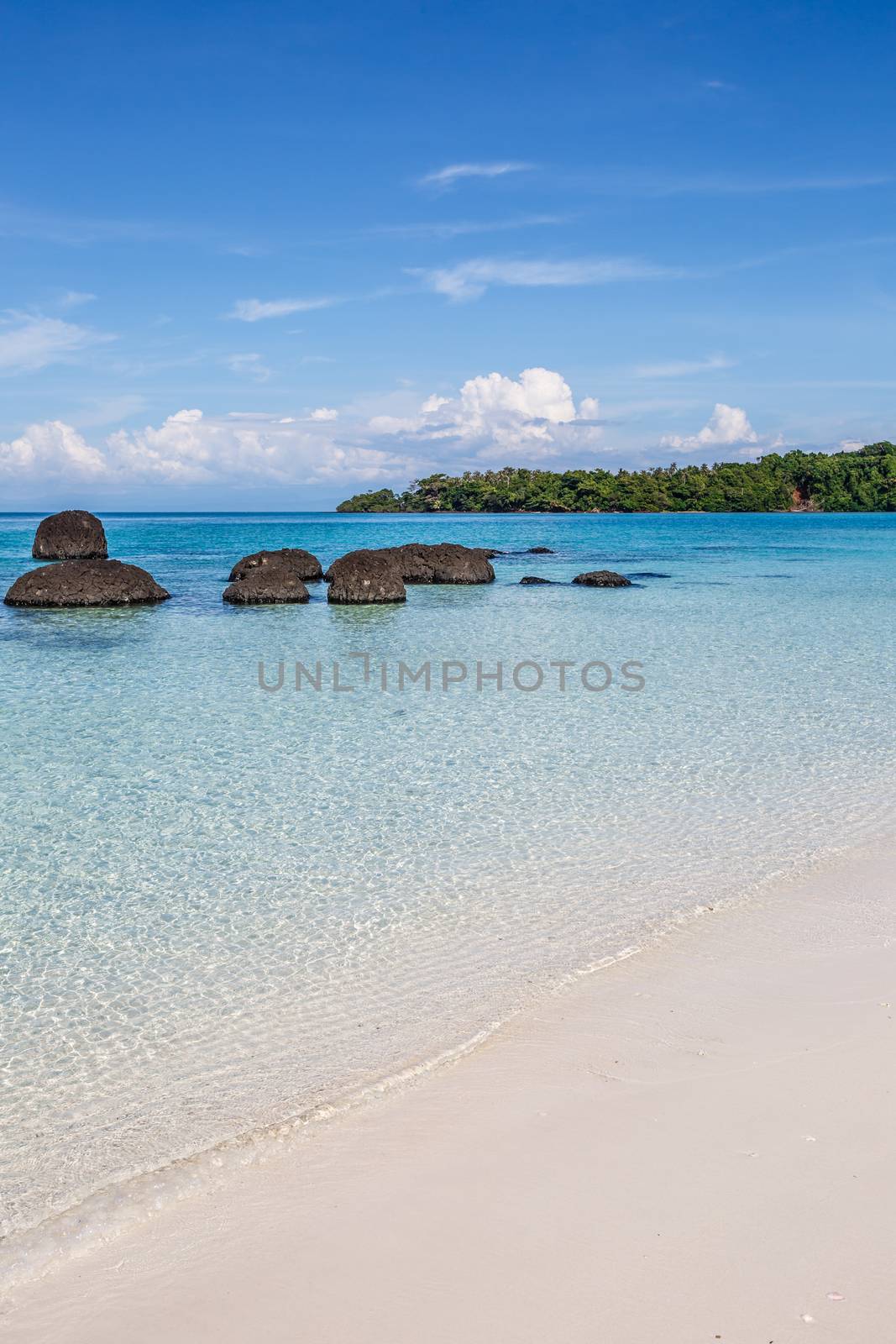 white sand and blue sky on beautiful beach