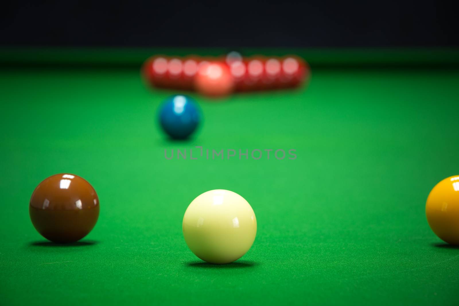 snooker balls set on a green table