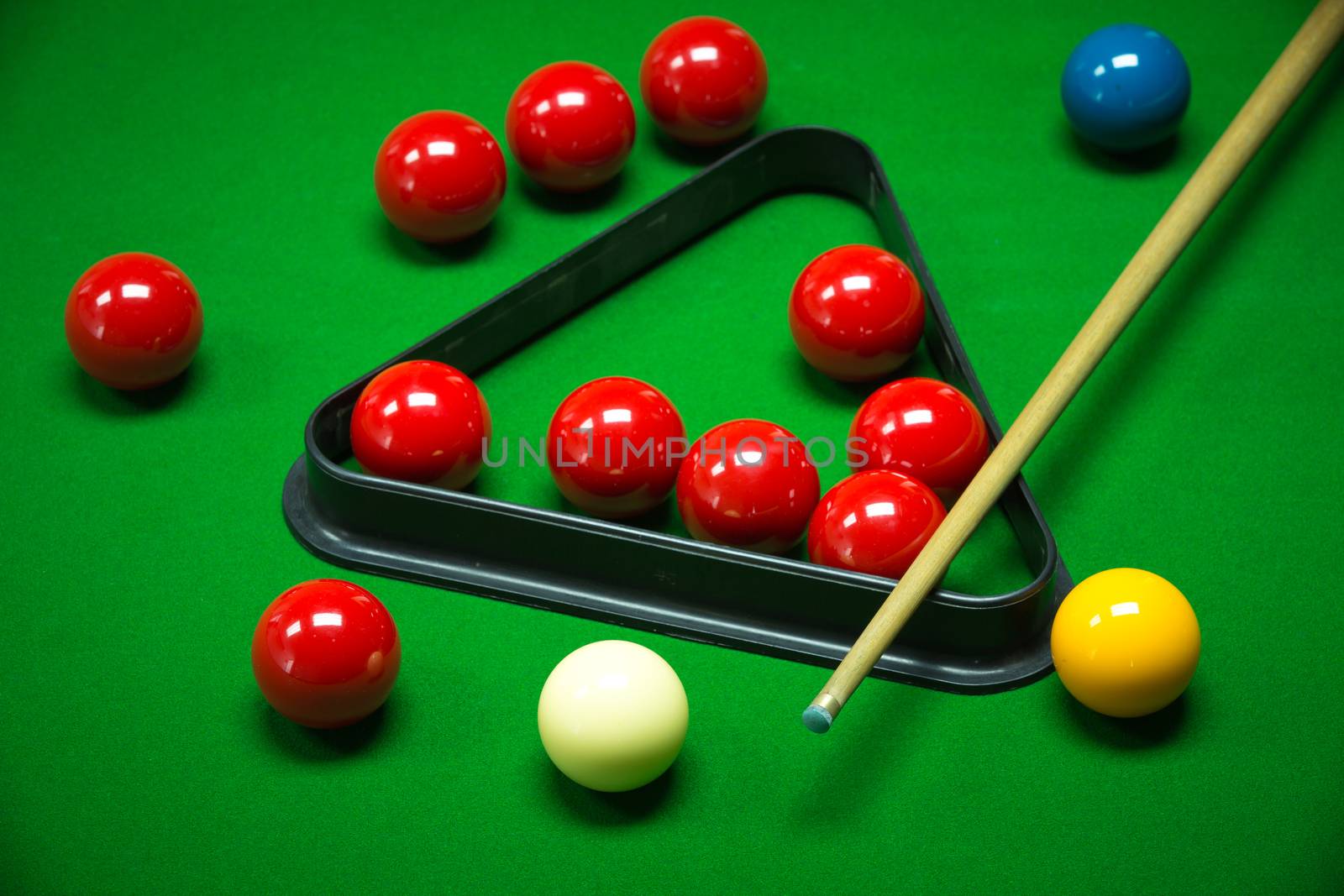 snooker balls set on a green table