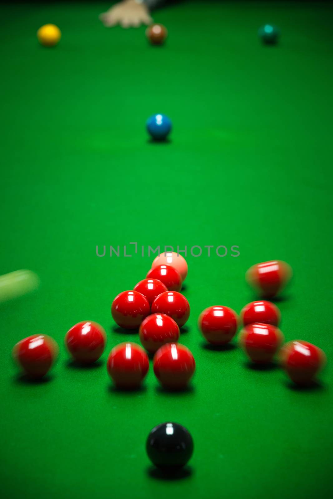 snooker balls set on a green table