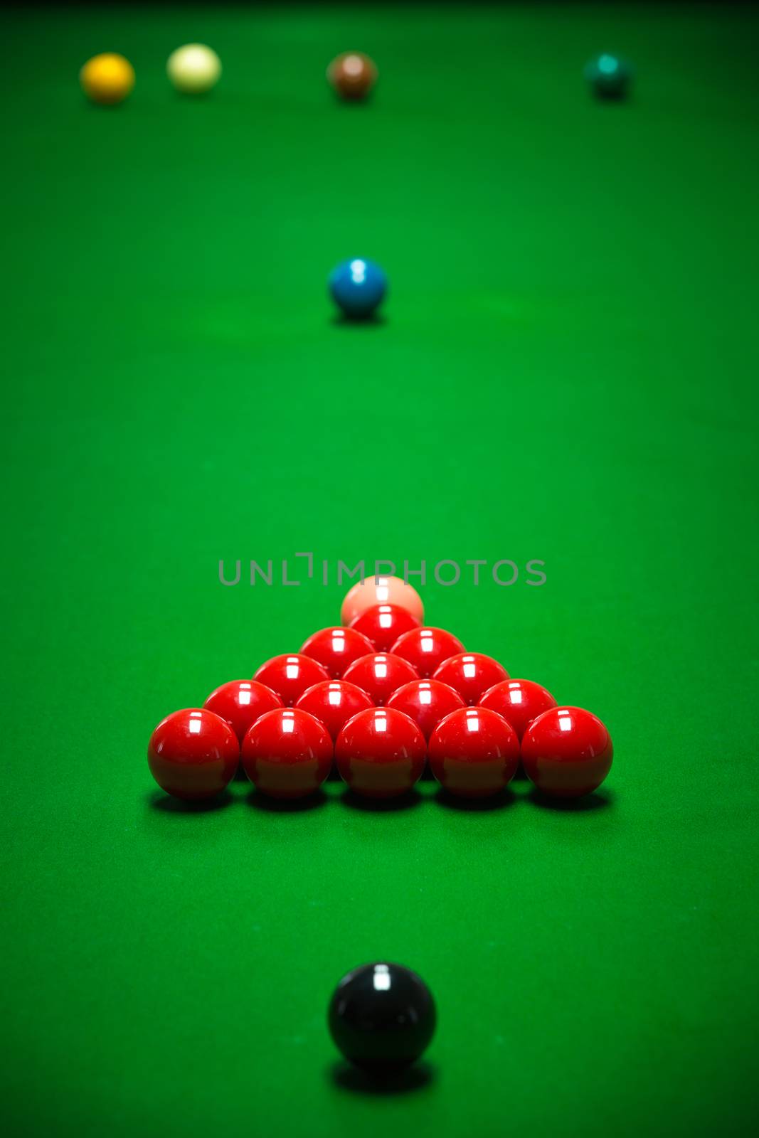 snooker balls set on a green table