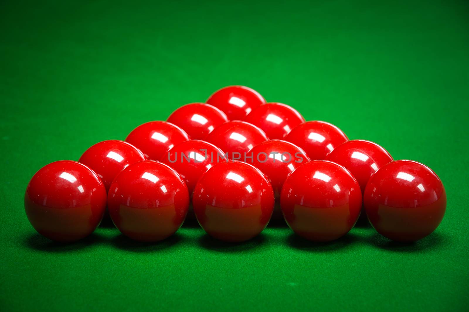 snooker balls set on a green table