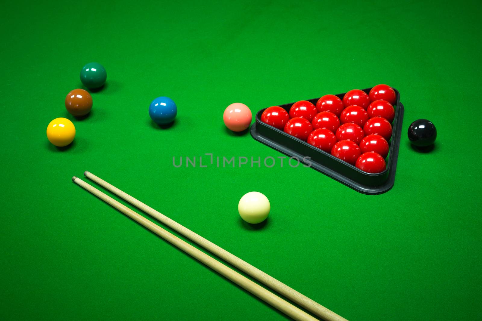 snooker balls set on a green table