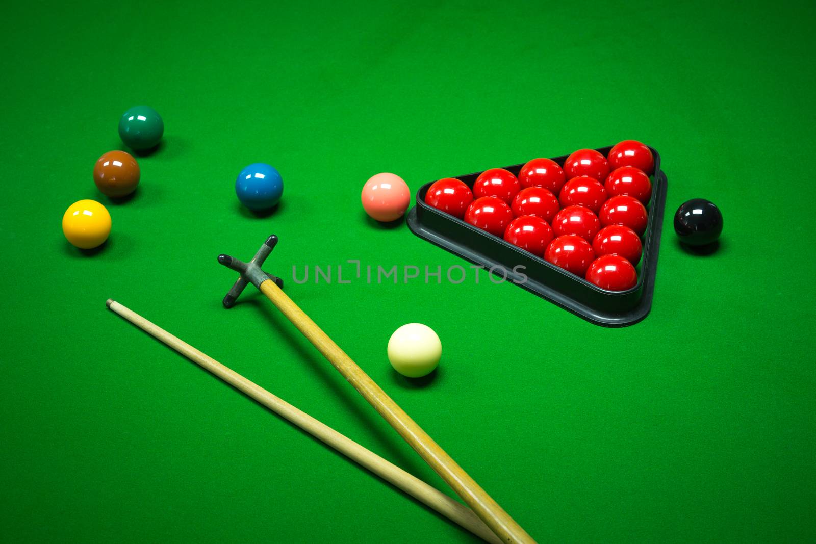 snooker balls set on a green table