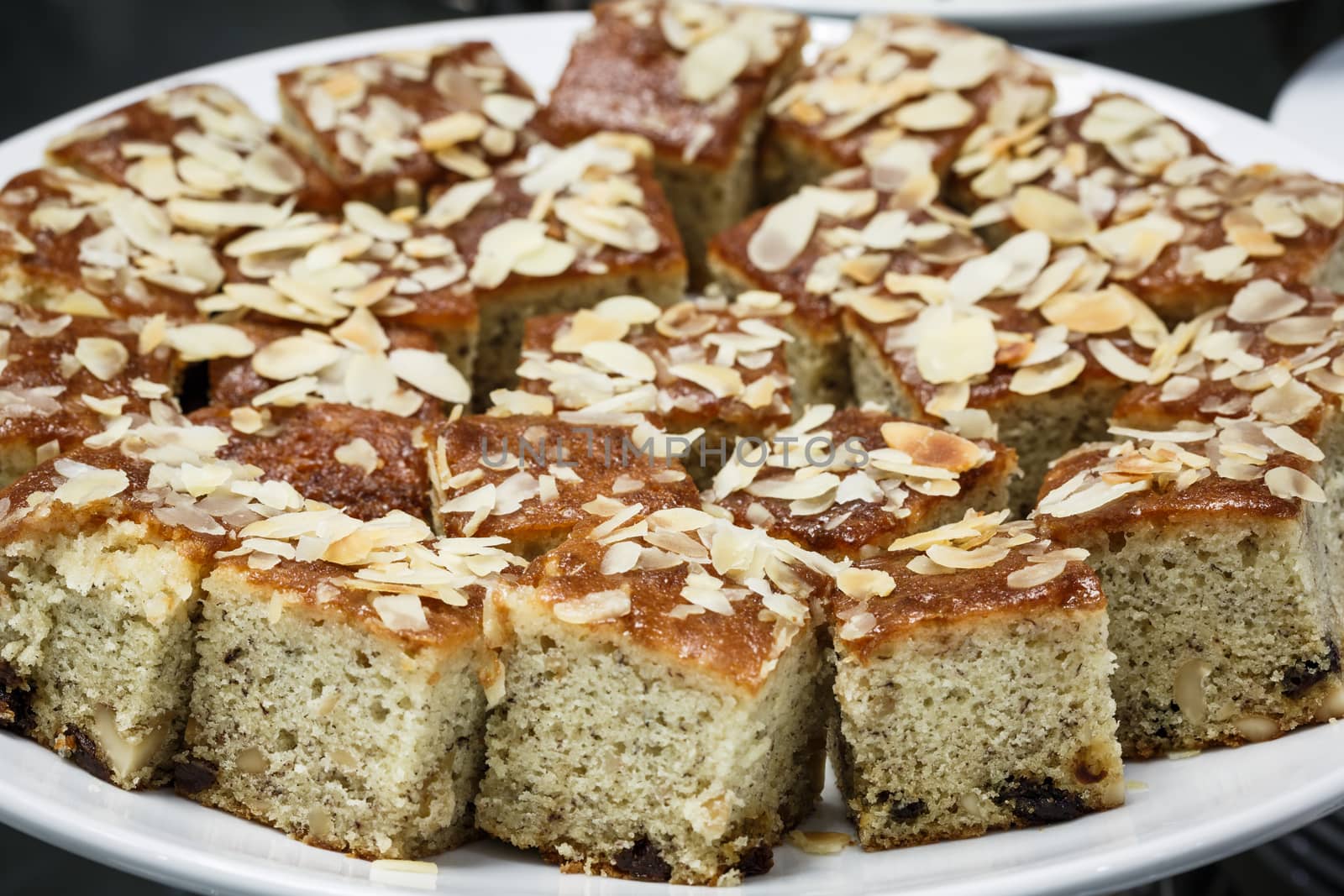 fruit cake topping with almond slice