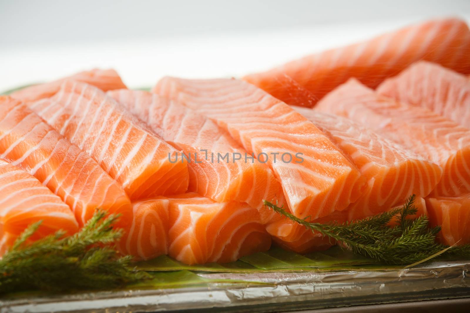 some salmon sashimi in a glass box wait for eat