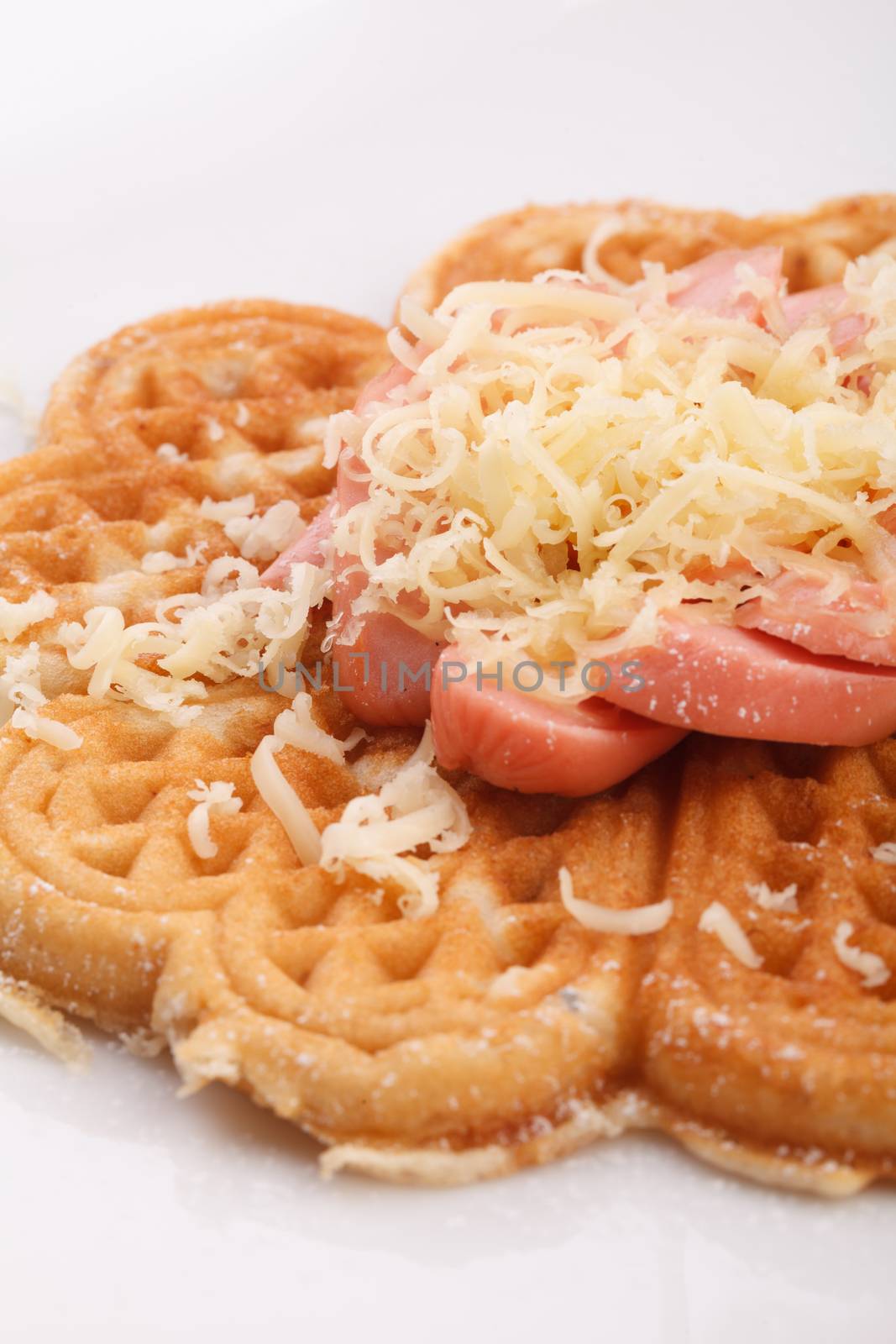 waffle with sausace topping with shred cheese