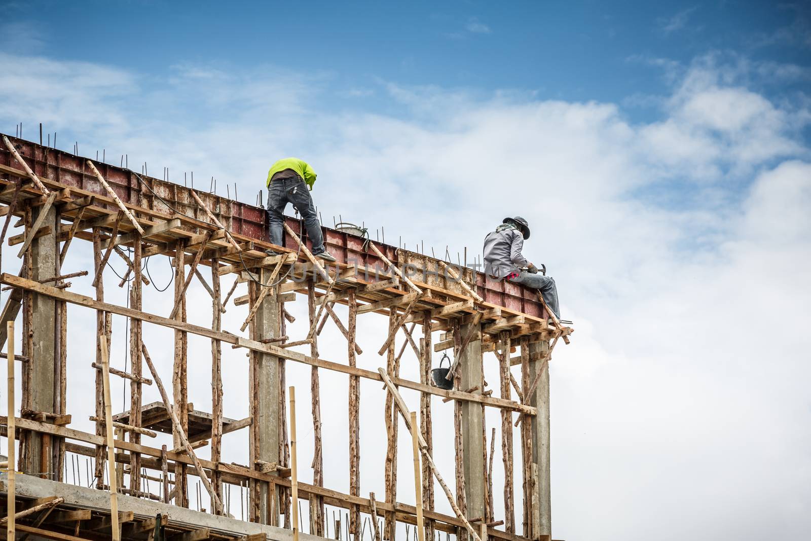 foreman and worker in construction site