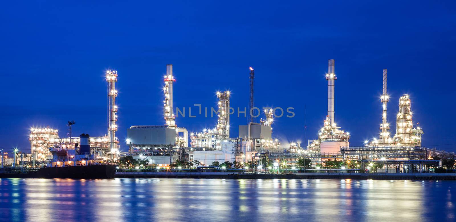Oil refinery and blue sky near a river at thailand