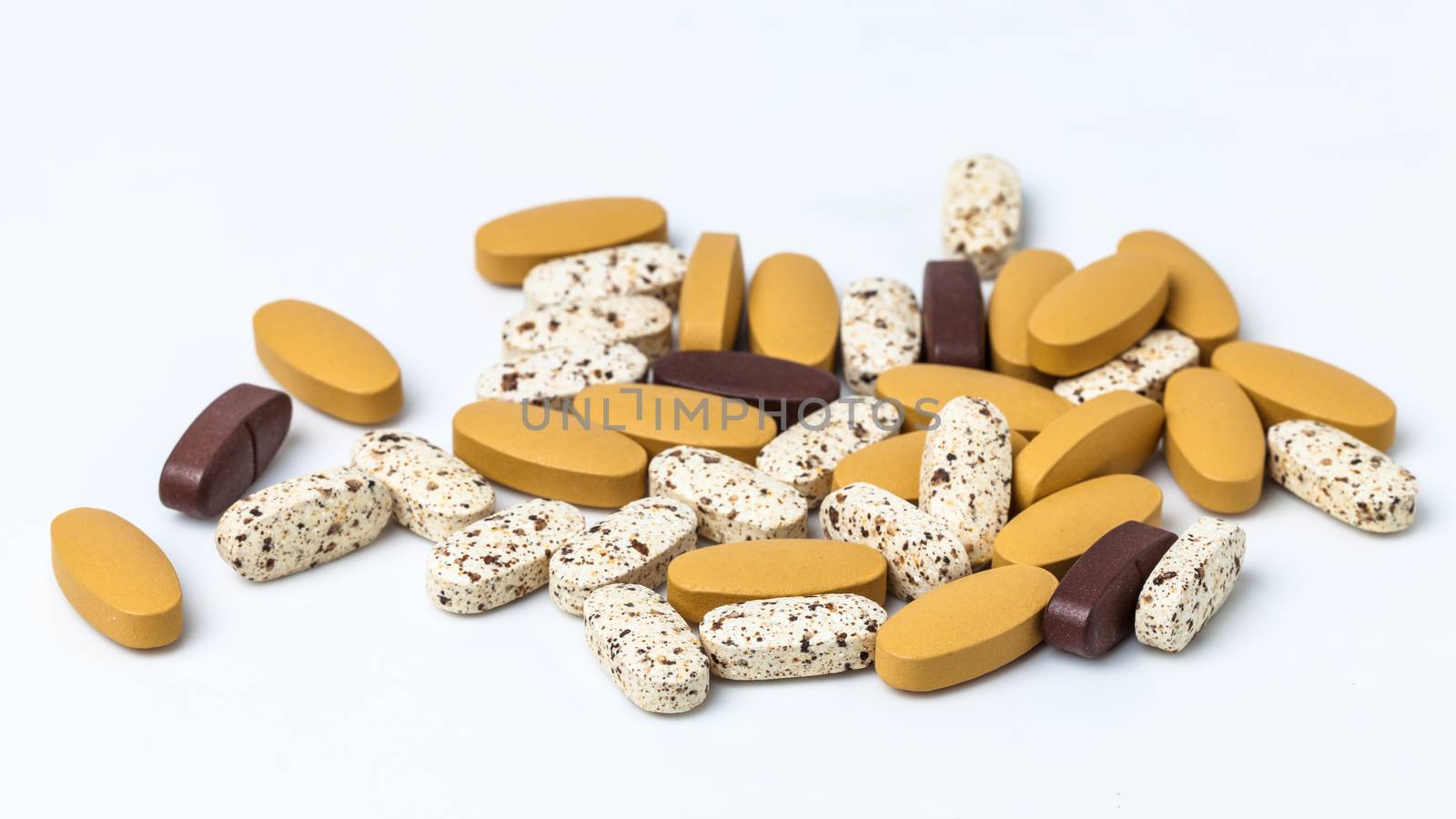 vitamin pills on white background