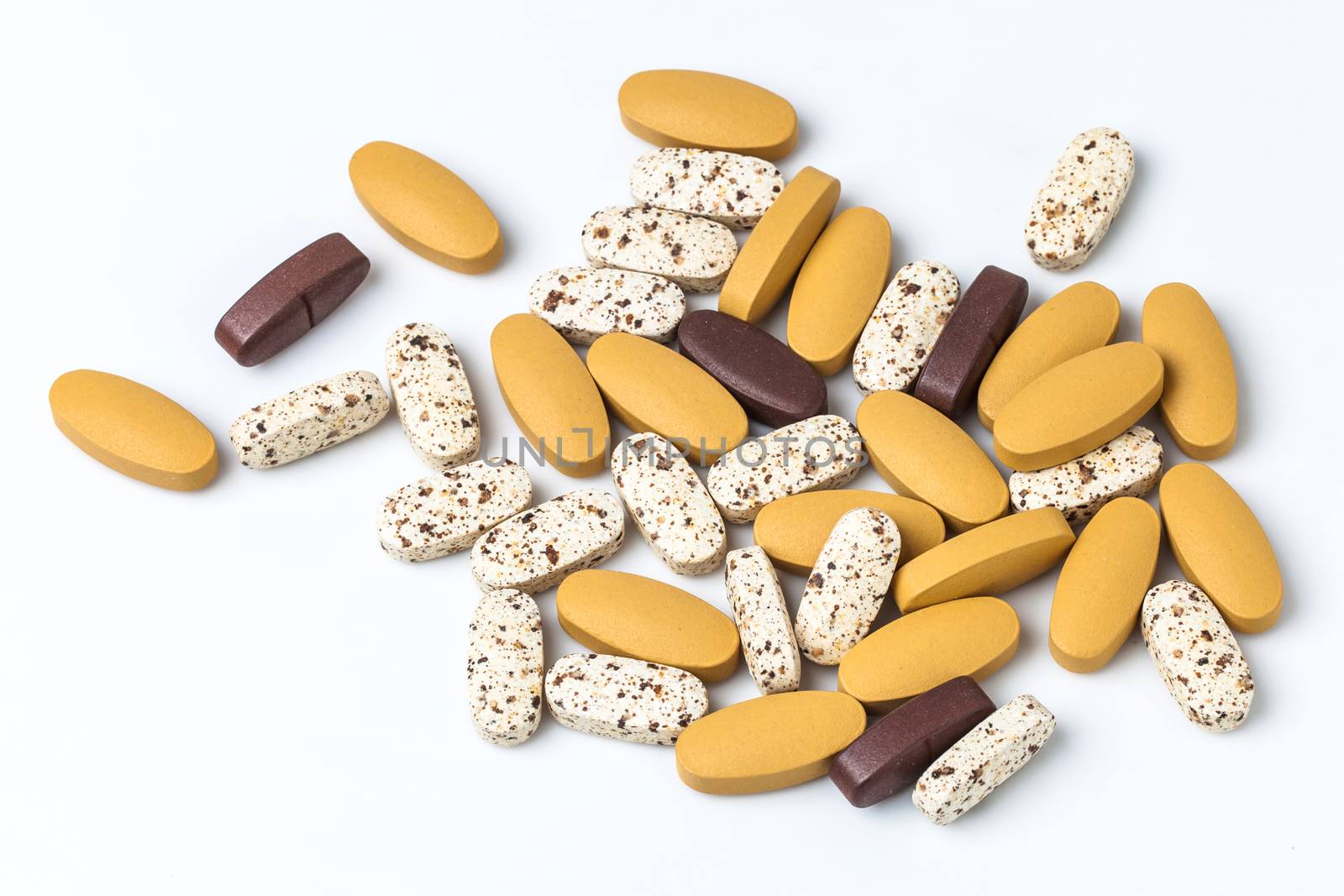 vitamin pills on white background