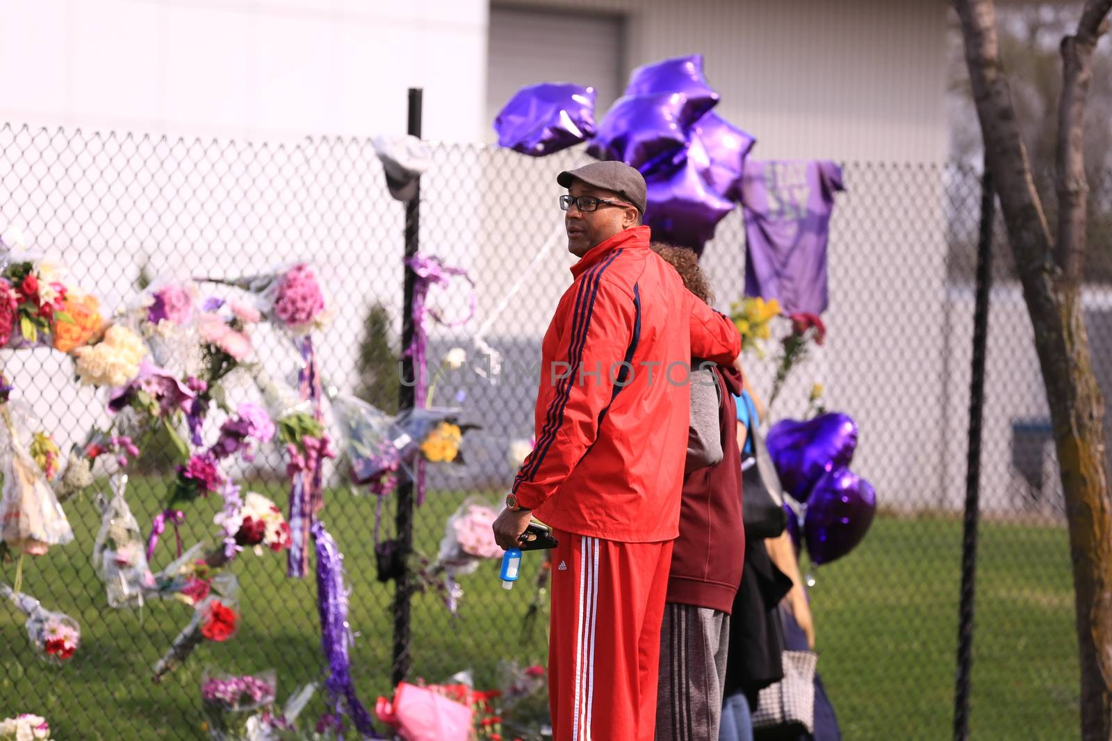 MINNESOTTA, Chanhassen: Fans pay their respects outside the Paisley Park residential compound of music legend Prince in Chanhassen, near Minneapolis, Minnesota, on April 21, 2016. Emergency personnel tried and failed to revive music legend Prince, who died April 21, 2016, at age 57, after finding him slumped unresponsive in an elevator at his Paisley Park studios in Minnesota, the local sheriff said.