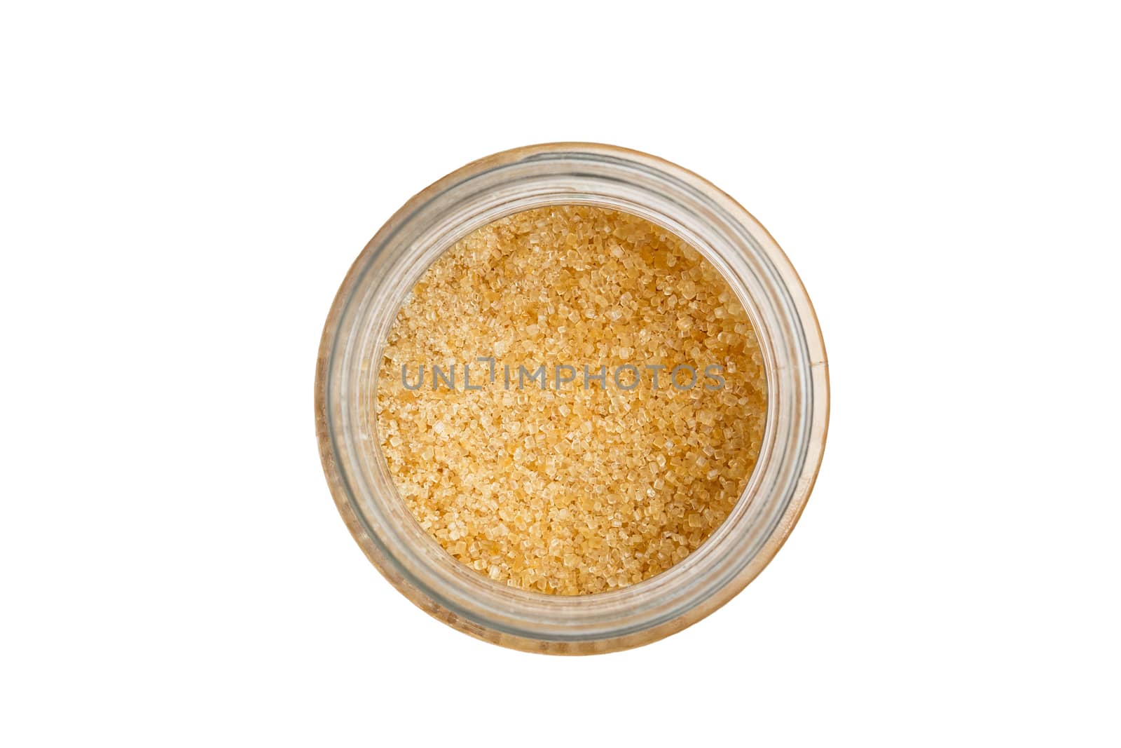 Isolated brown sugar in jar with white background.