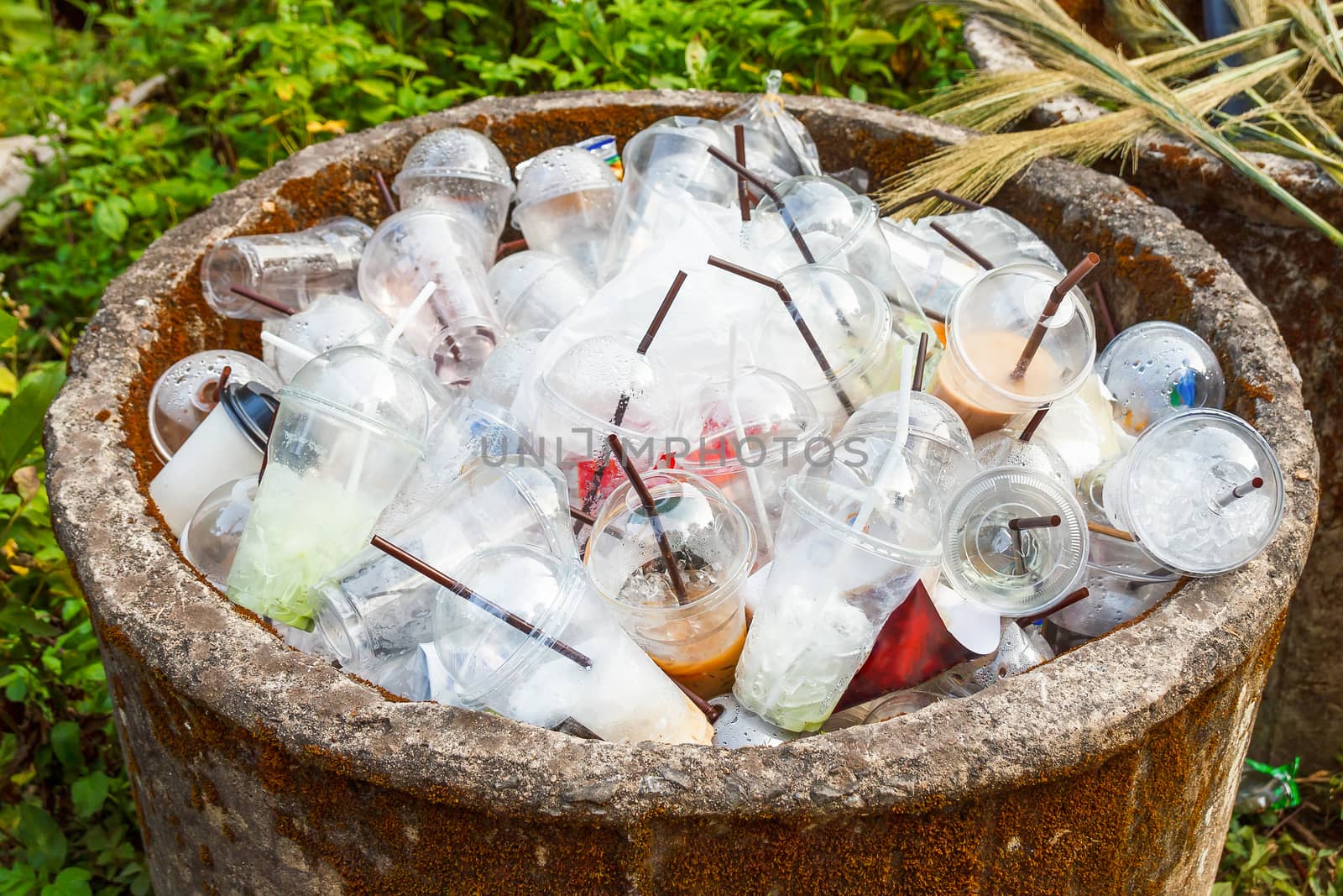 Heap of plastic cups in trashcan.