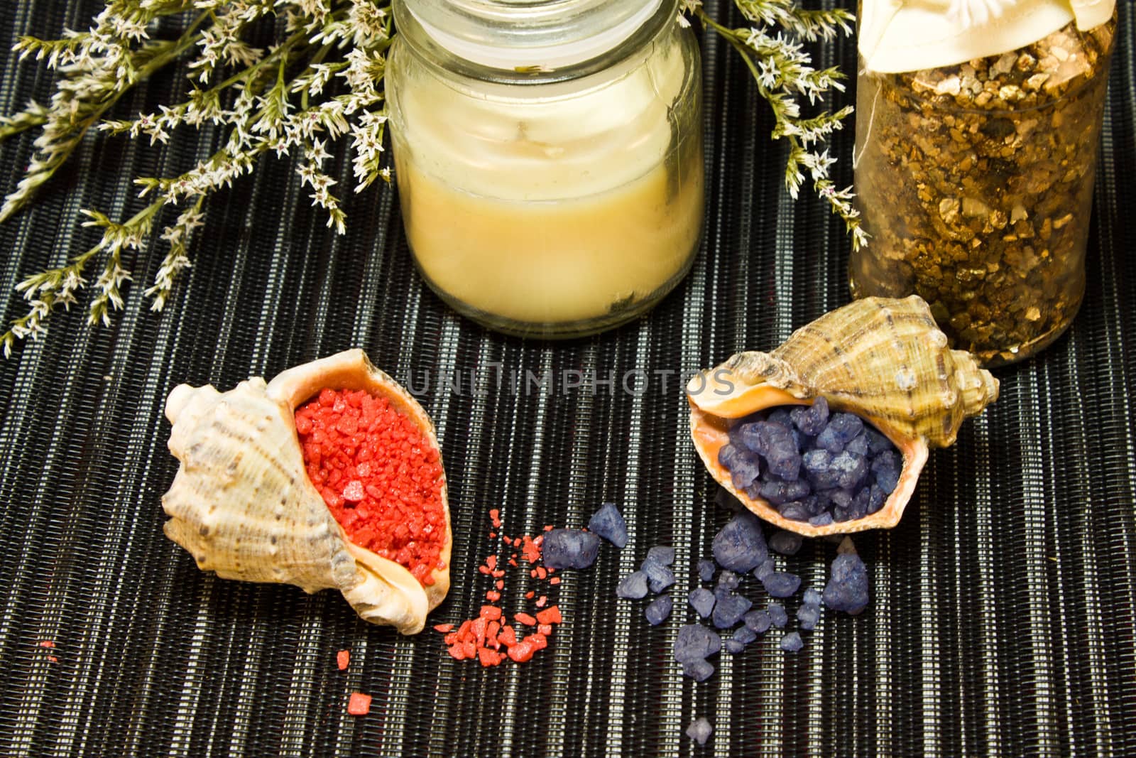 Still life of tools for massage and bath salts in shells