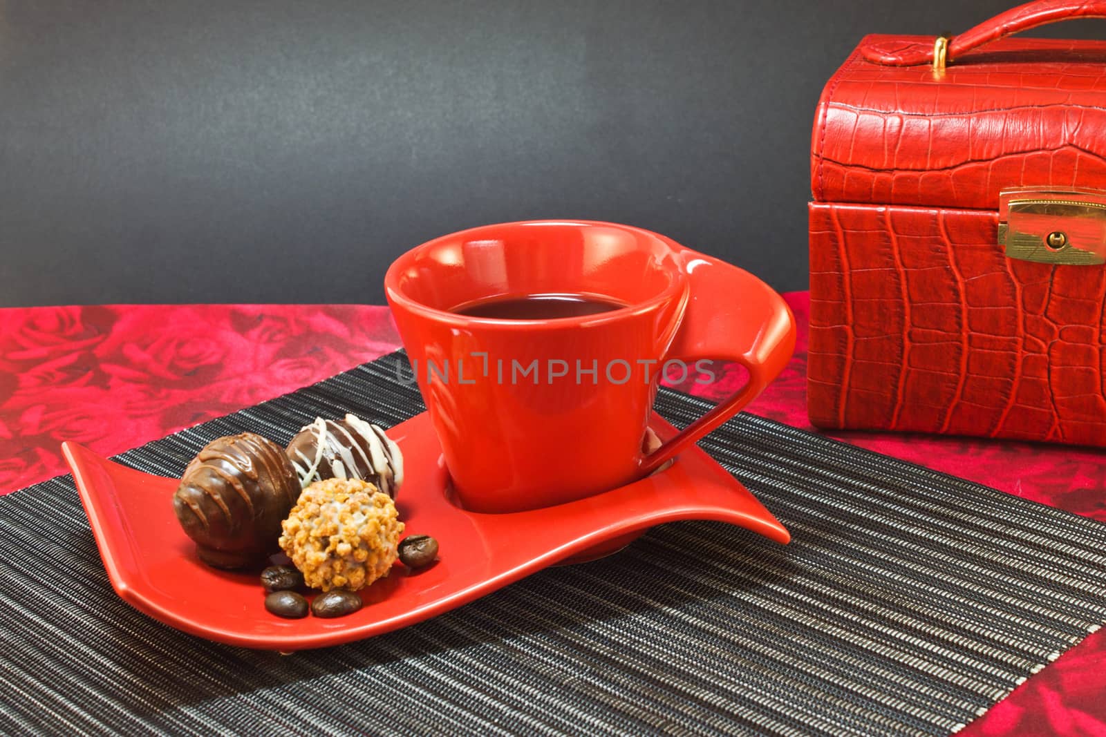 Coffee in red cup on a background of jewelry box by LenoraA