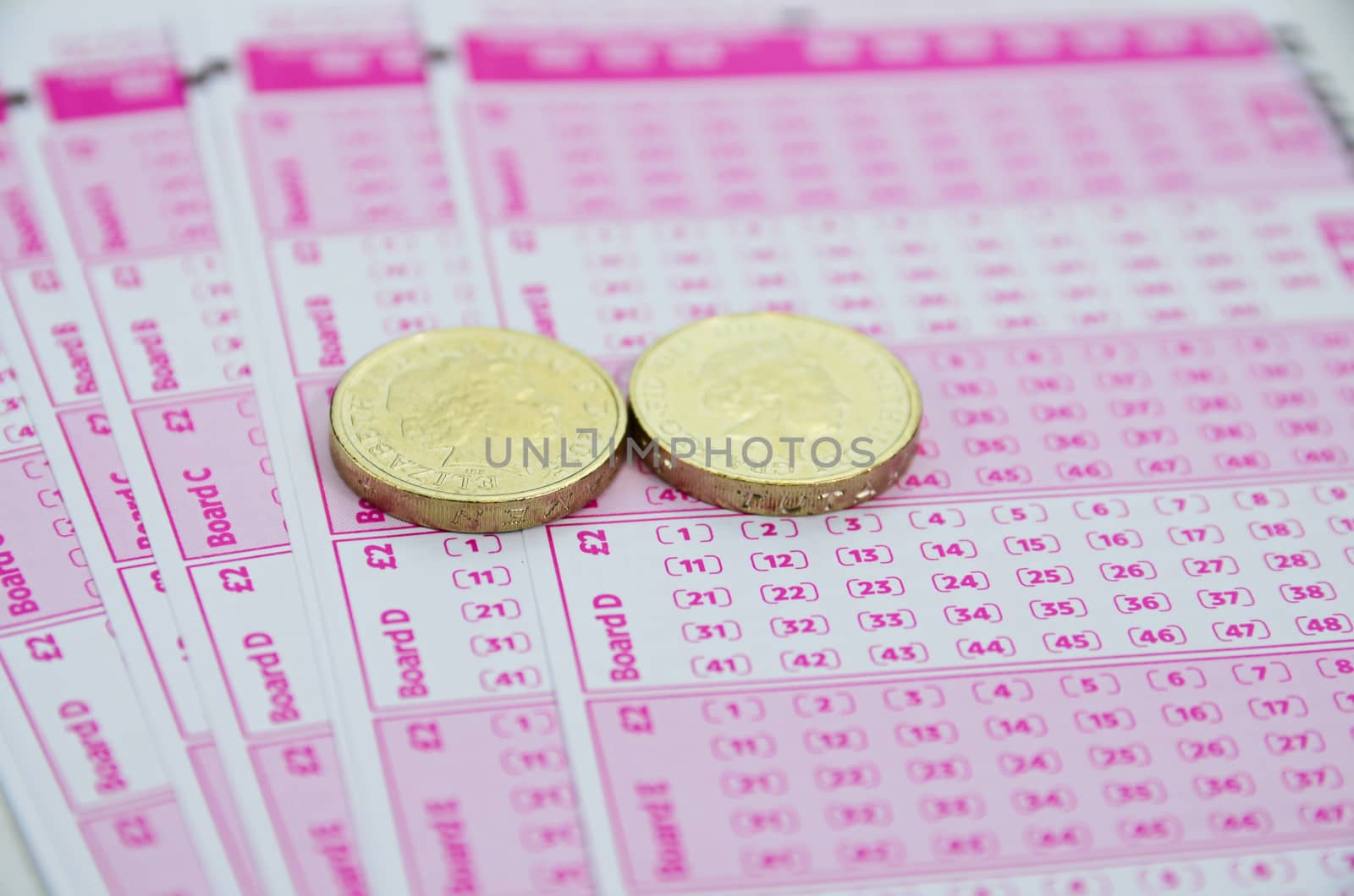 Blank lotto tickets scattered on white background