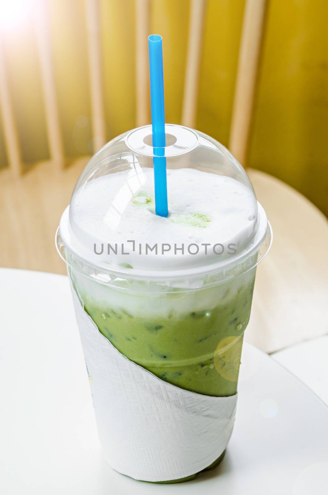 ice milk green tea matcha on table.