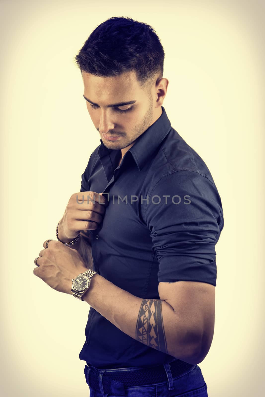 Young man in blue shirt and jeans by artofphoto