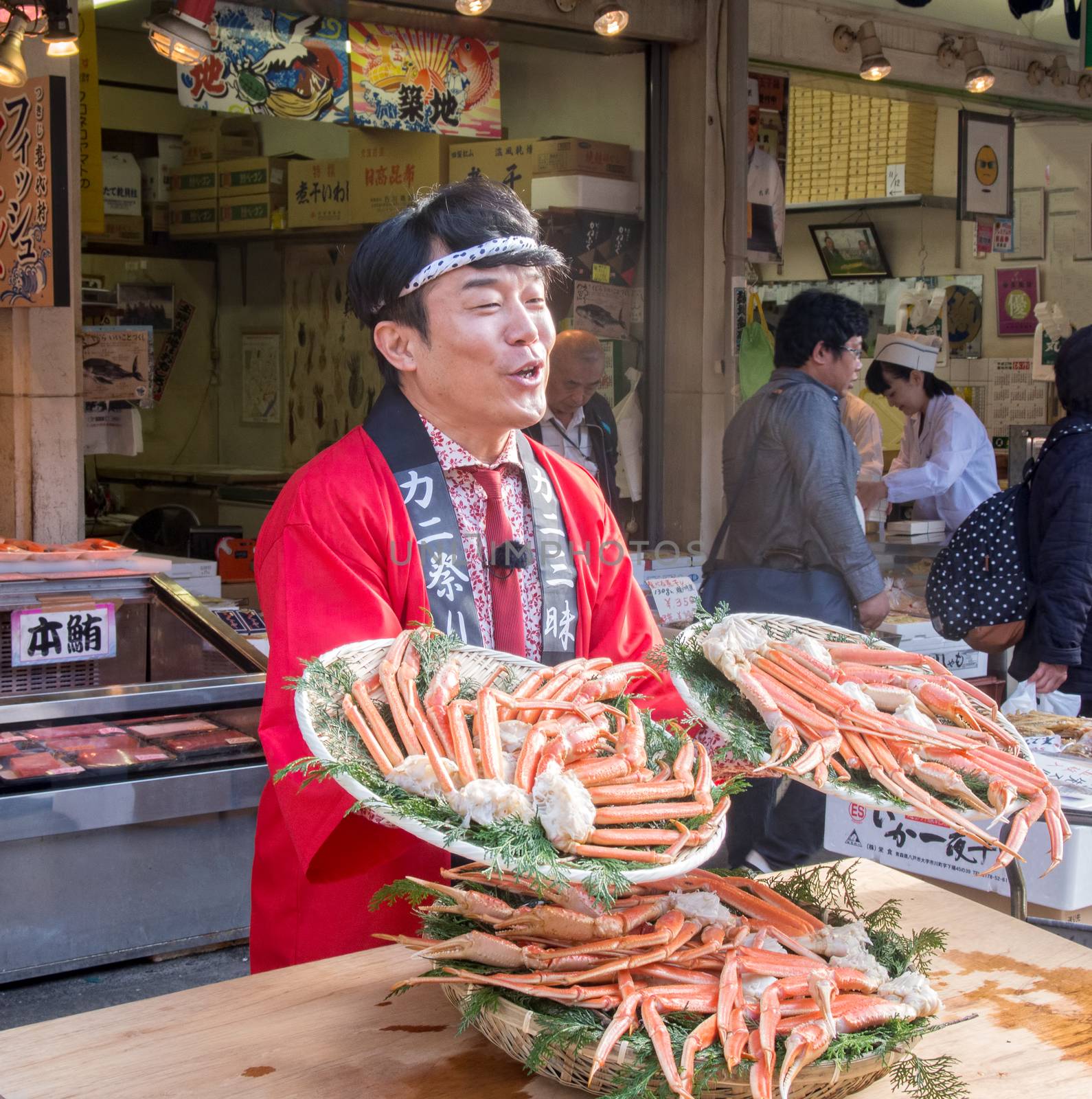 Tokyo, Japan - November 13, 2015: Tsukiji fish market. Tsukiji is the biggest freshest fish market in the world. Shop around Tsukiji peddling their giant crabs.