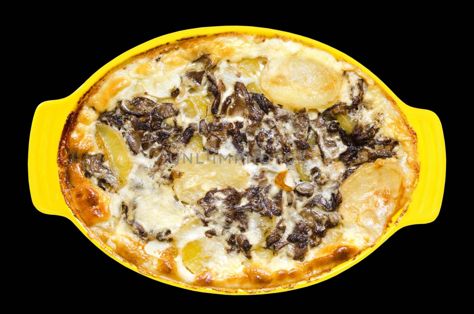 Sliced potatoes with mushrooms, baked in cream, isolated on black background
