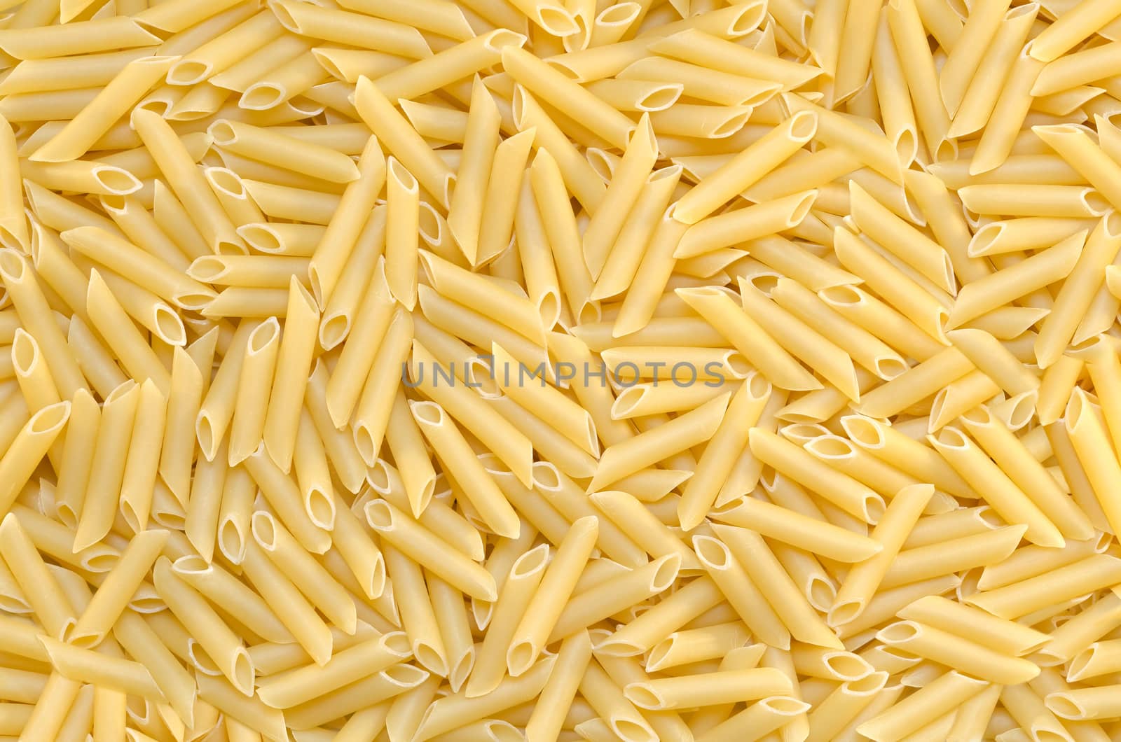 Background tubular pasta are on the surface, textured