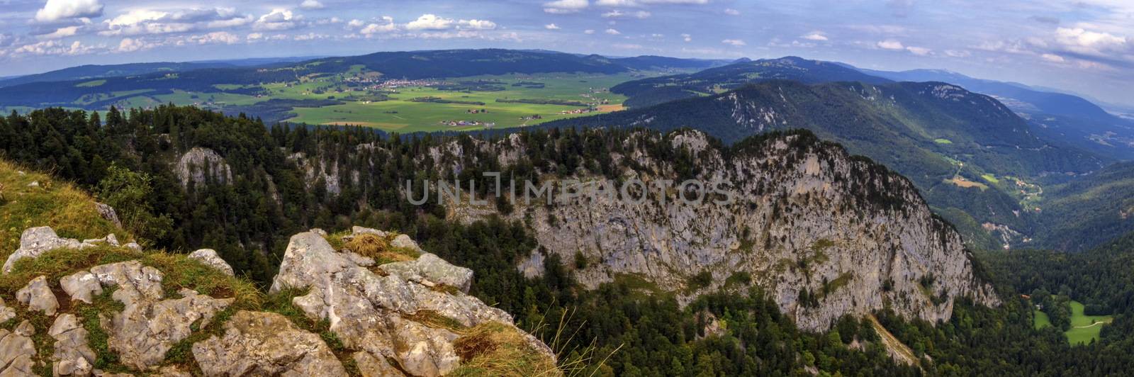 Panoramic view from the Creux-du-Van or Creux du Van rocky cirque at sunrise, Neuchatel canton, Switzerland