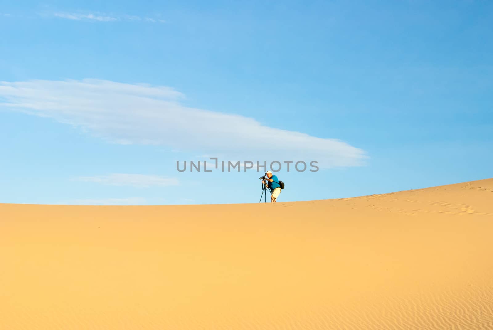 Male Photographer in Death Valley dunes by emattil