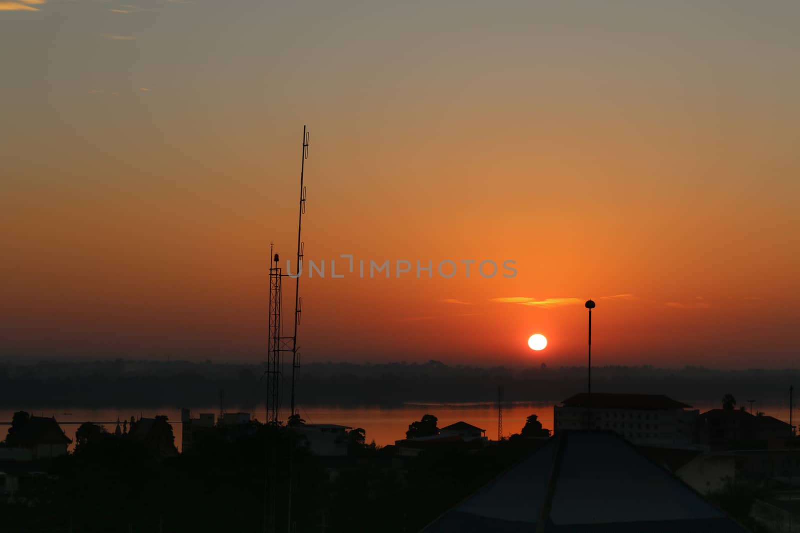 Sunrise over Mekong River in a Mukdahan city skyline