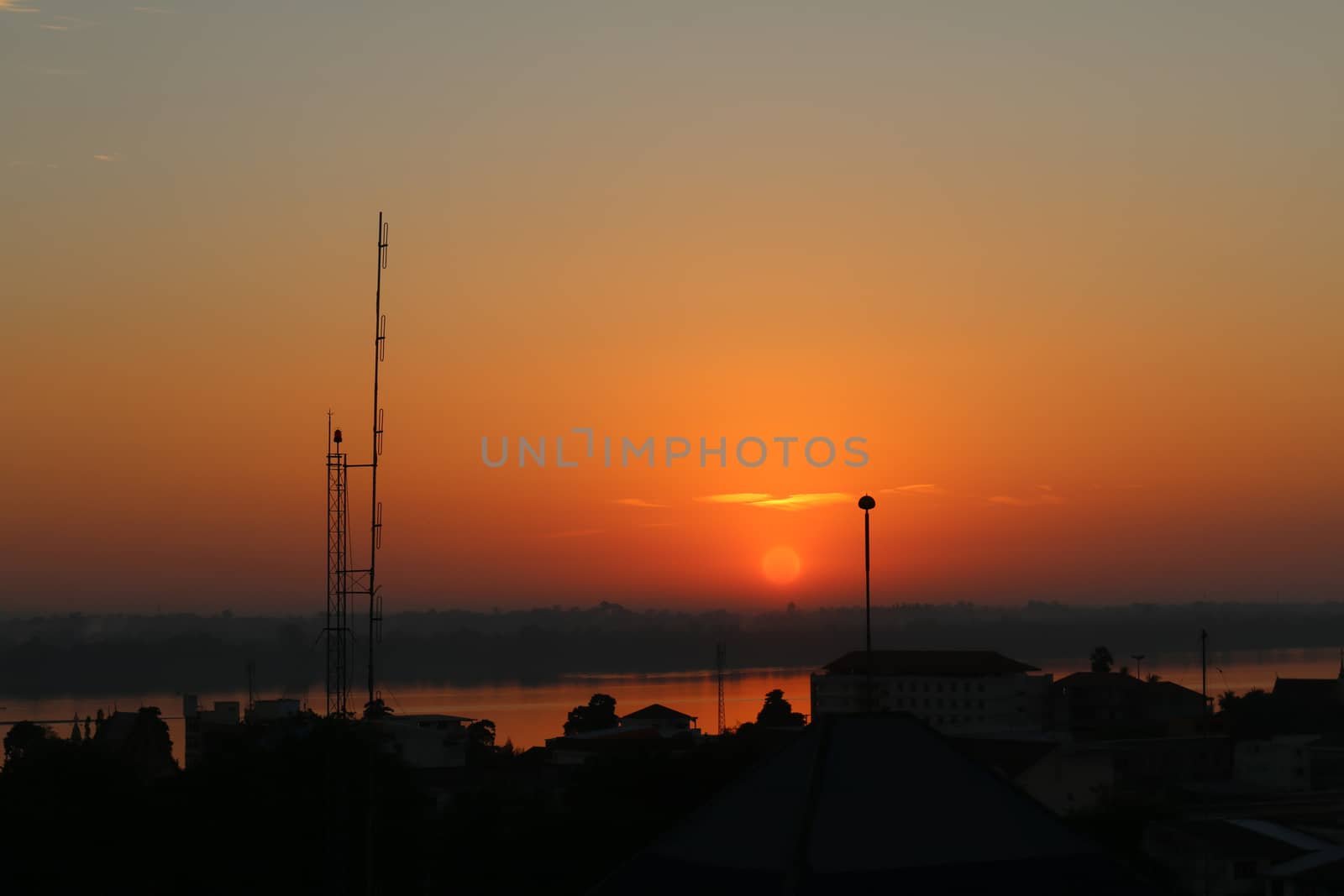 Sunrise over Mekong River in a Mukdahan city skyline